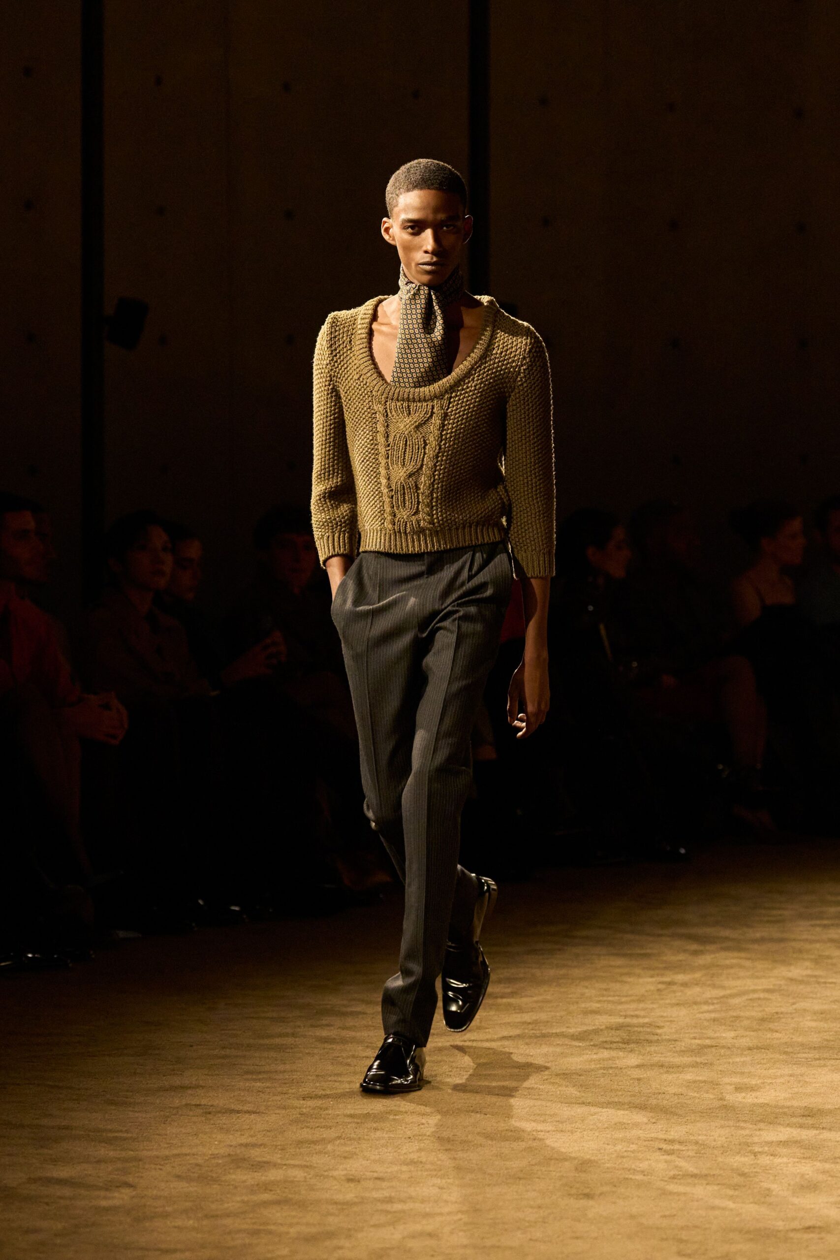 brown knit sweater with black pants