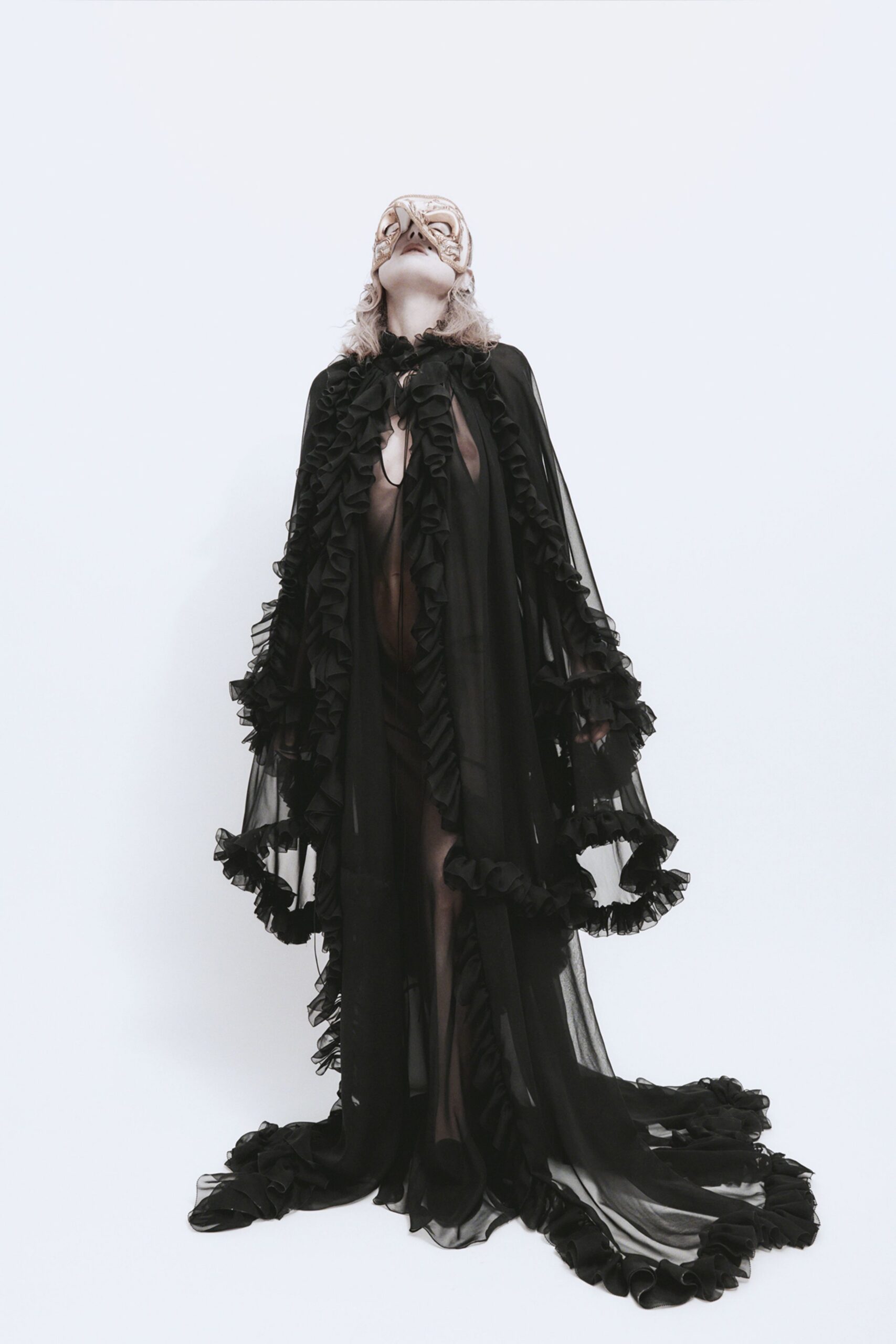 black ruffled chiffon cape