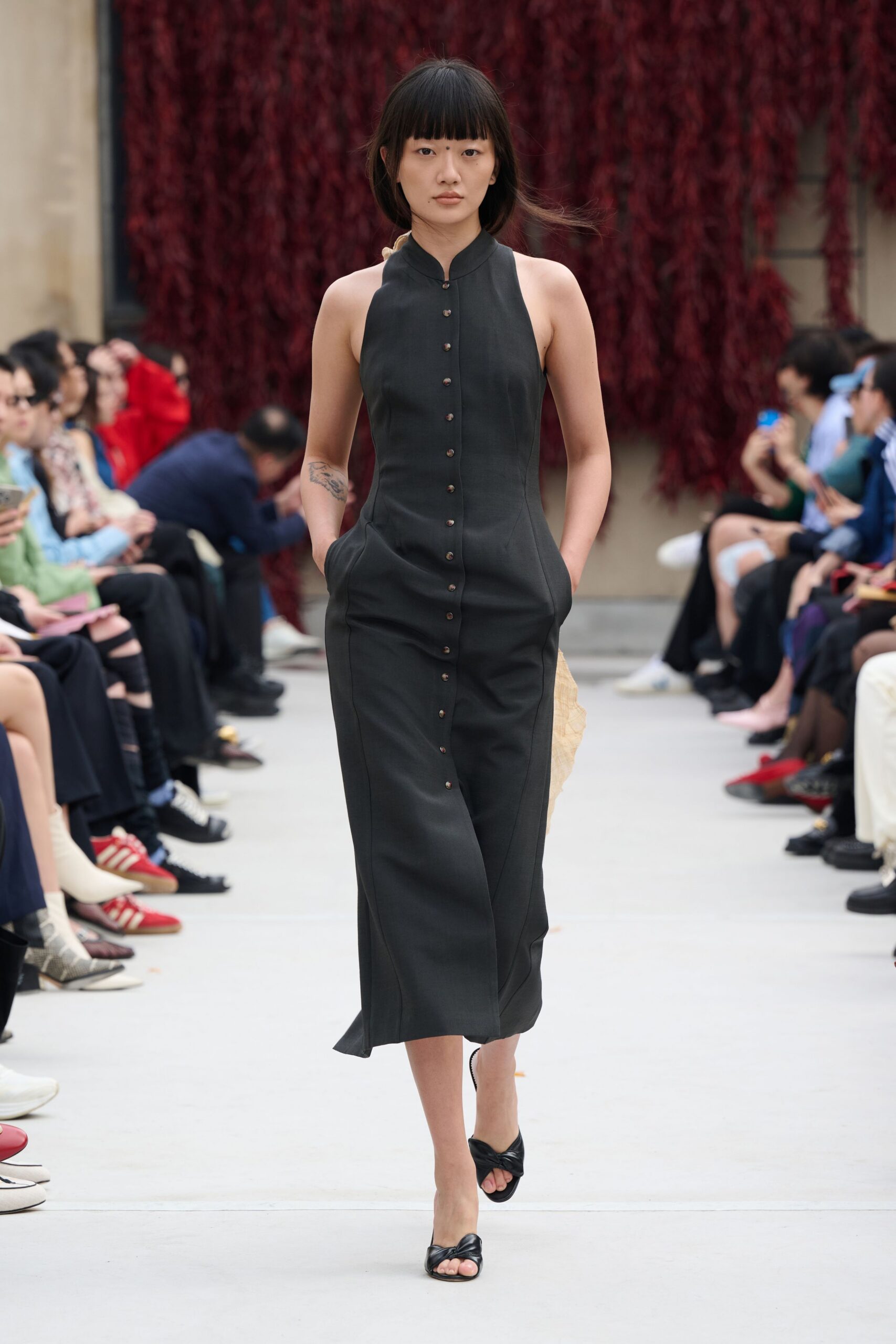 black fitted midi dress with open-toe shoes