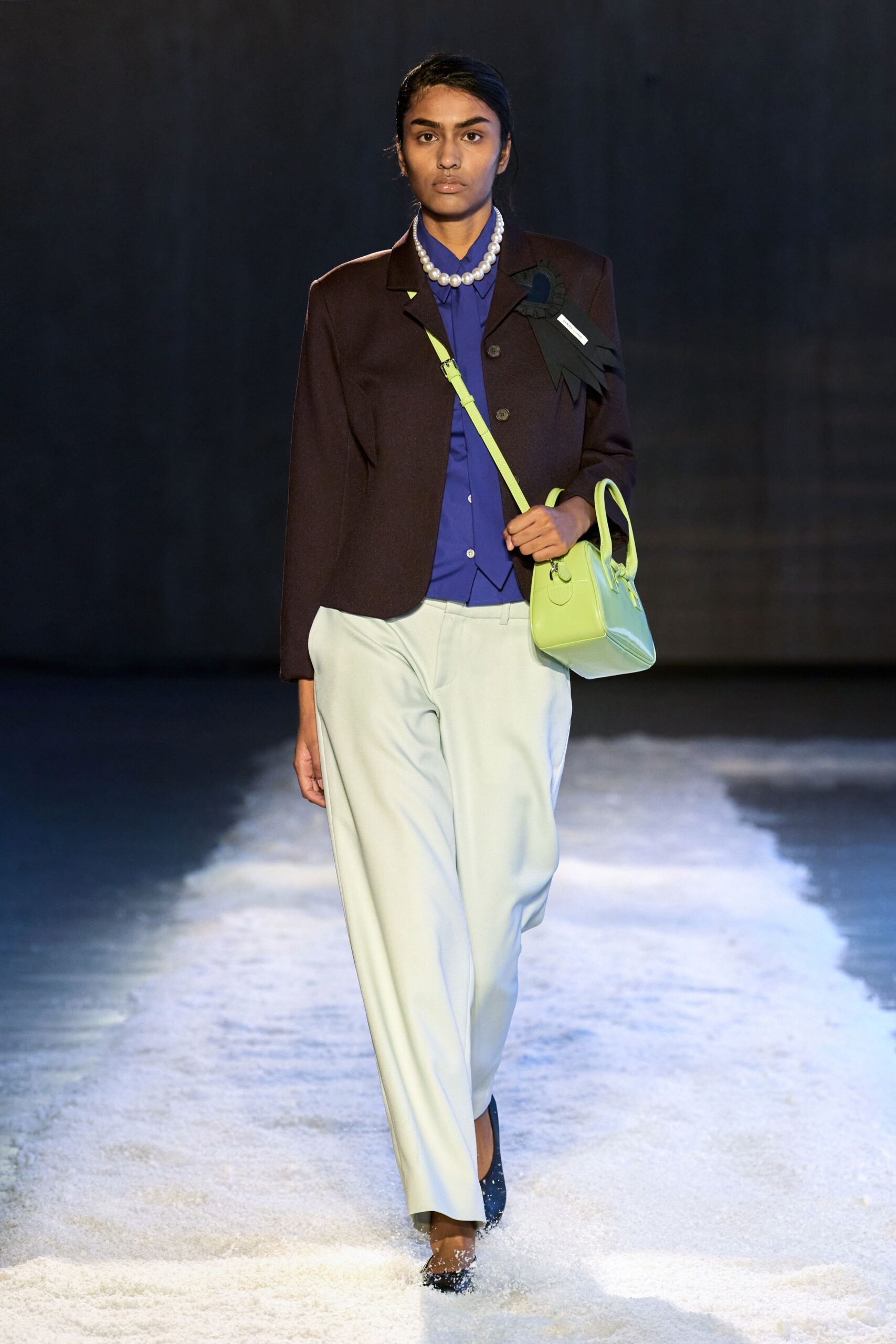 brown blazer blue shirt light green pants