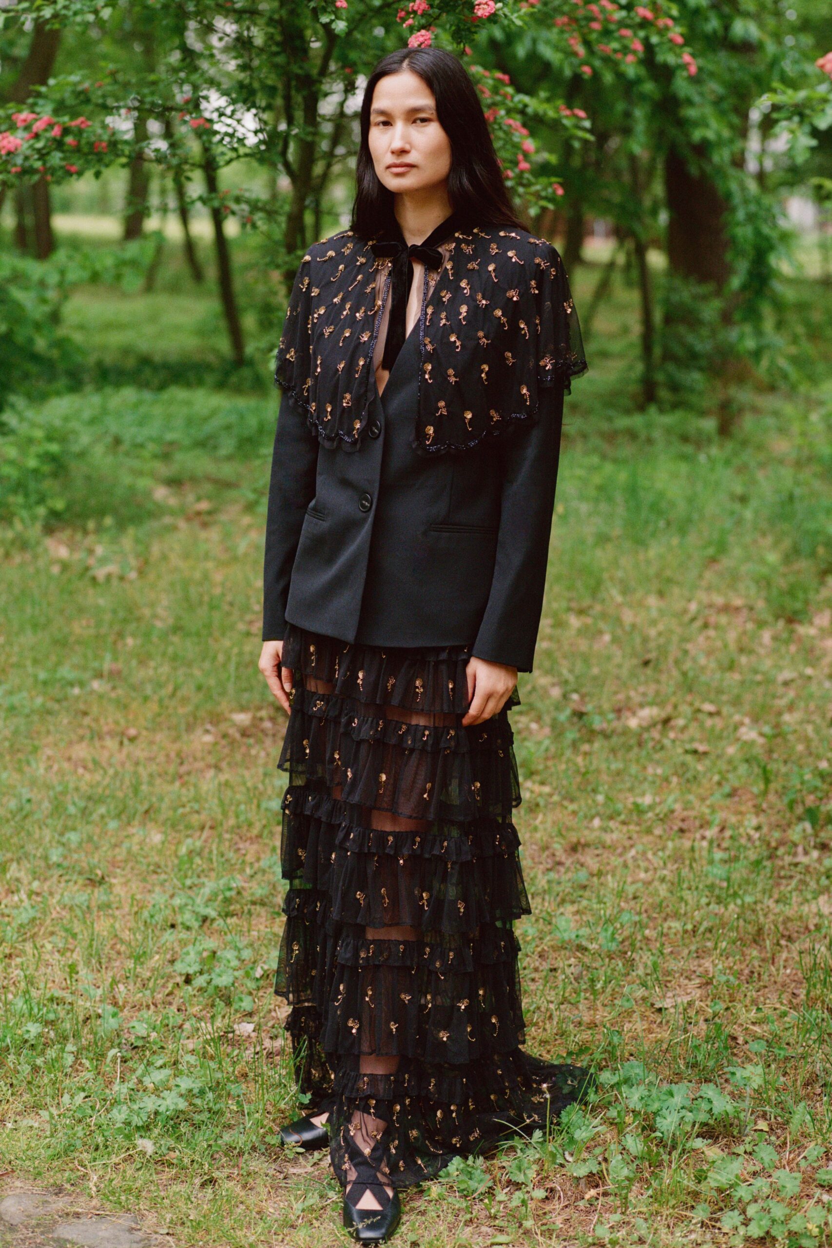 black tailored blazer and tiered dress