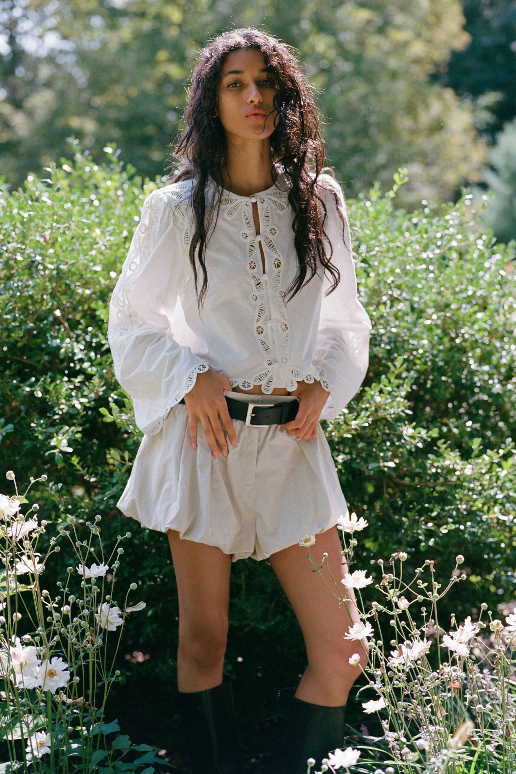 white embroidered blouse beige shorts