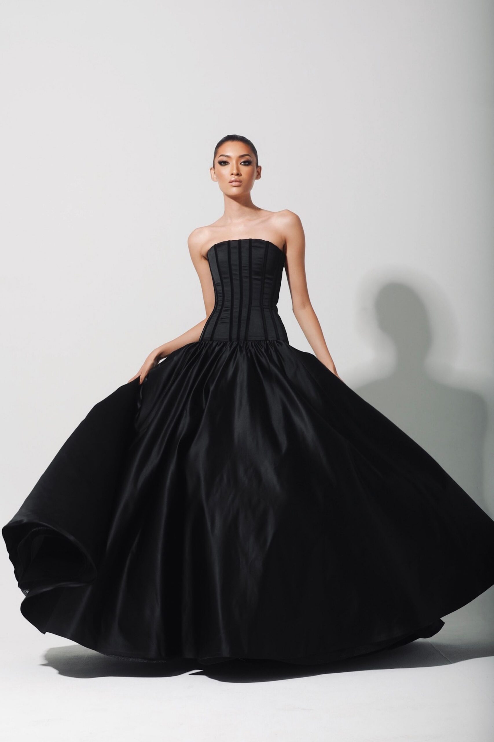 black strapless pleated gown