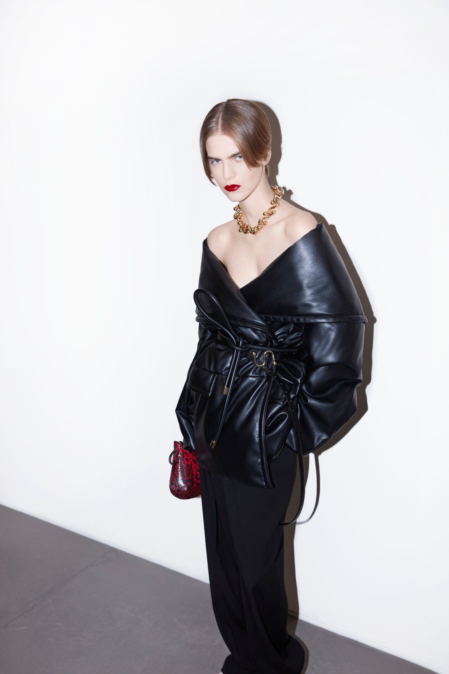 black leather long-sleeve off-shoulder fitted belted top