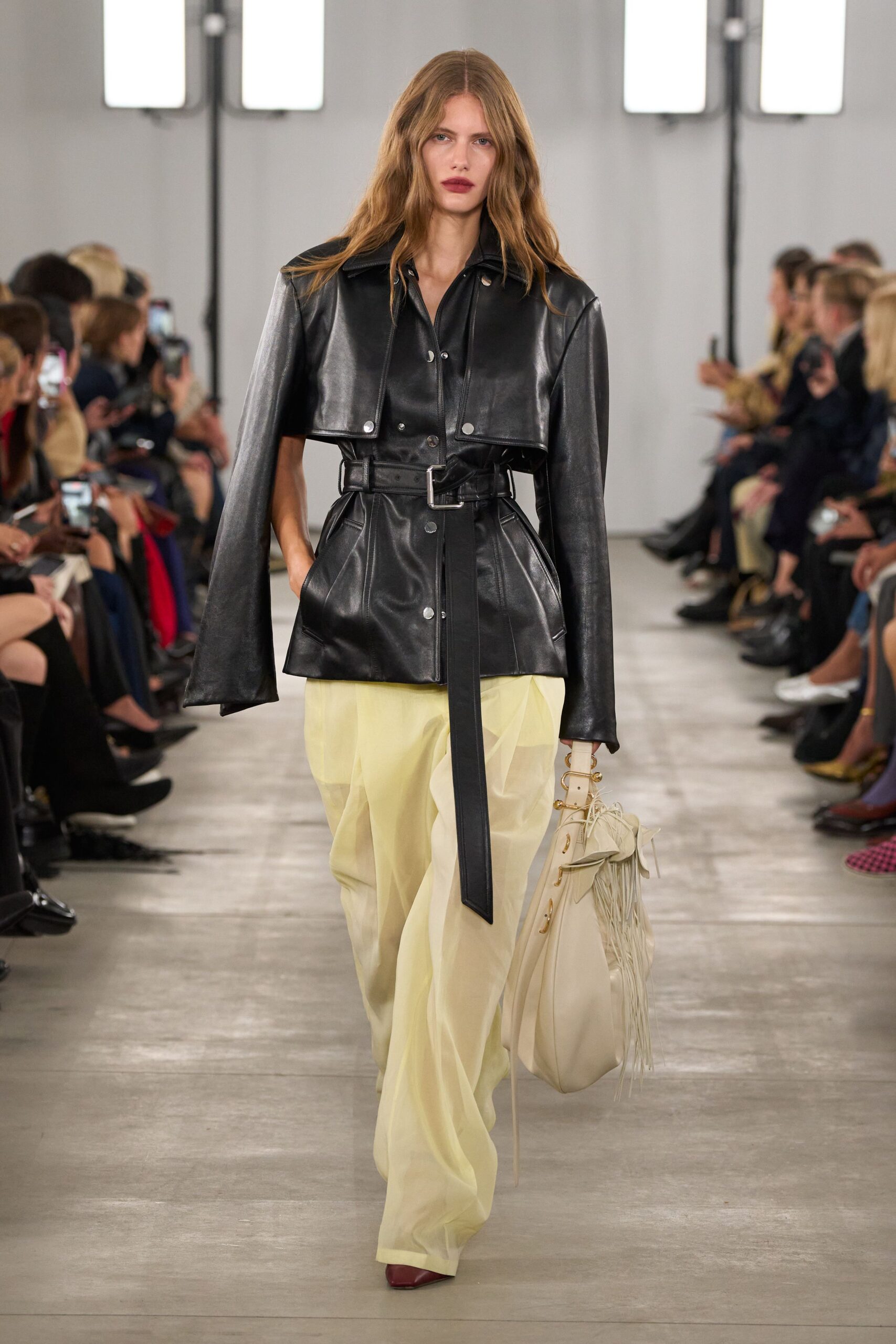 black leather long-sleeve collared fitted belted jacket