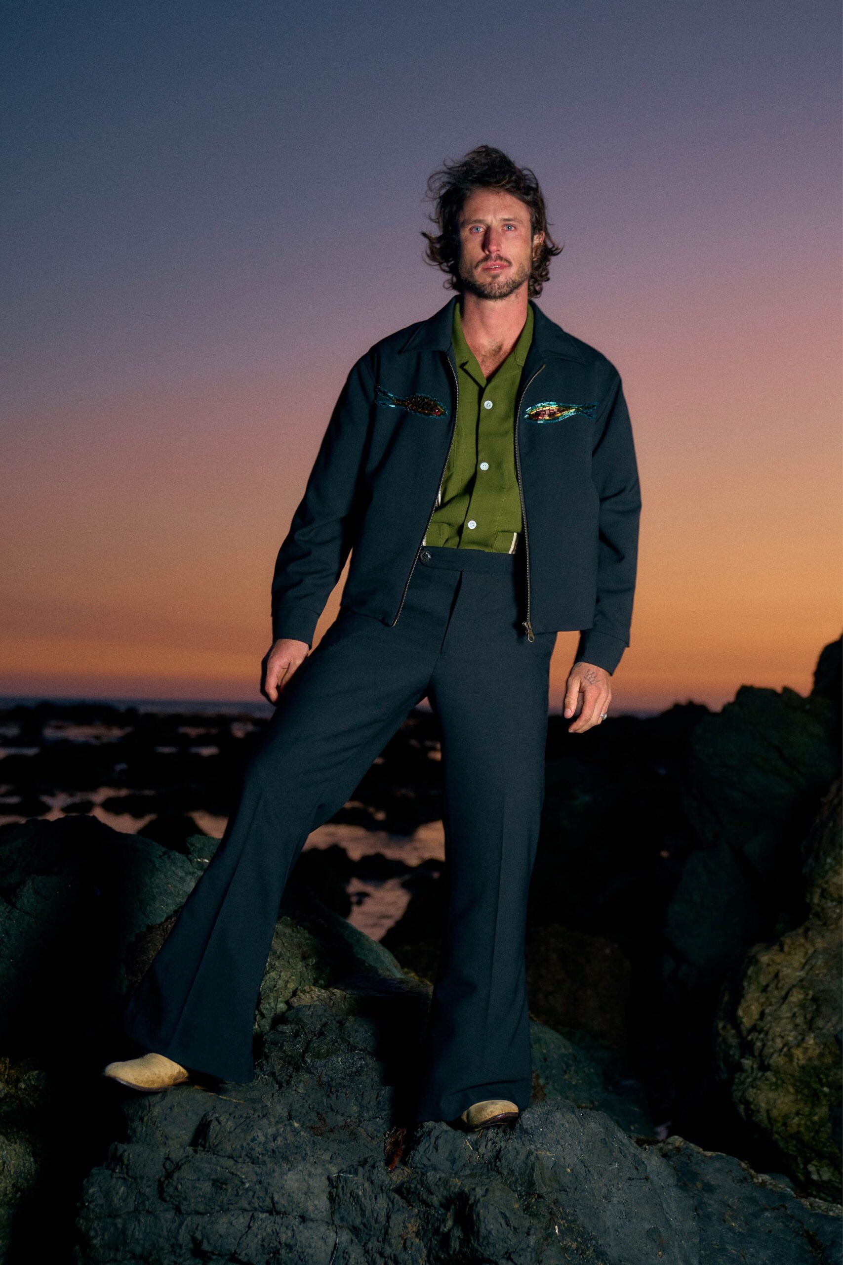 black jacket green shirt flared pants