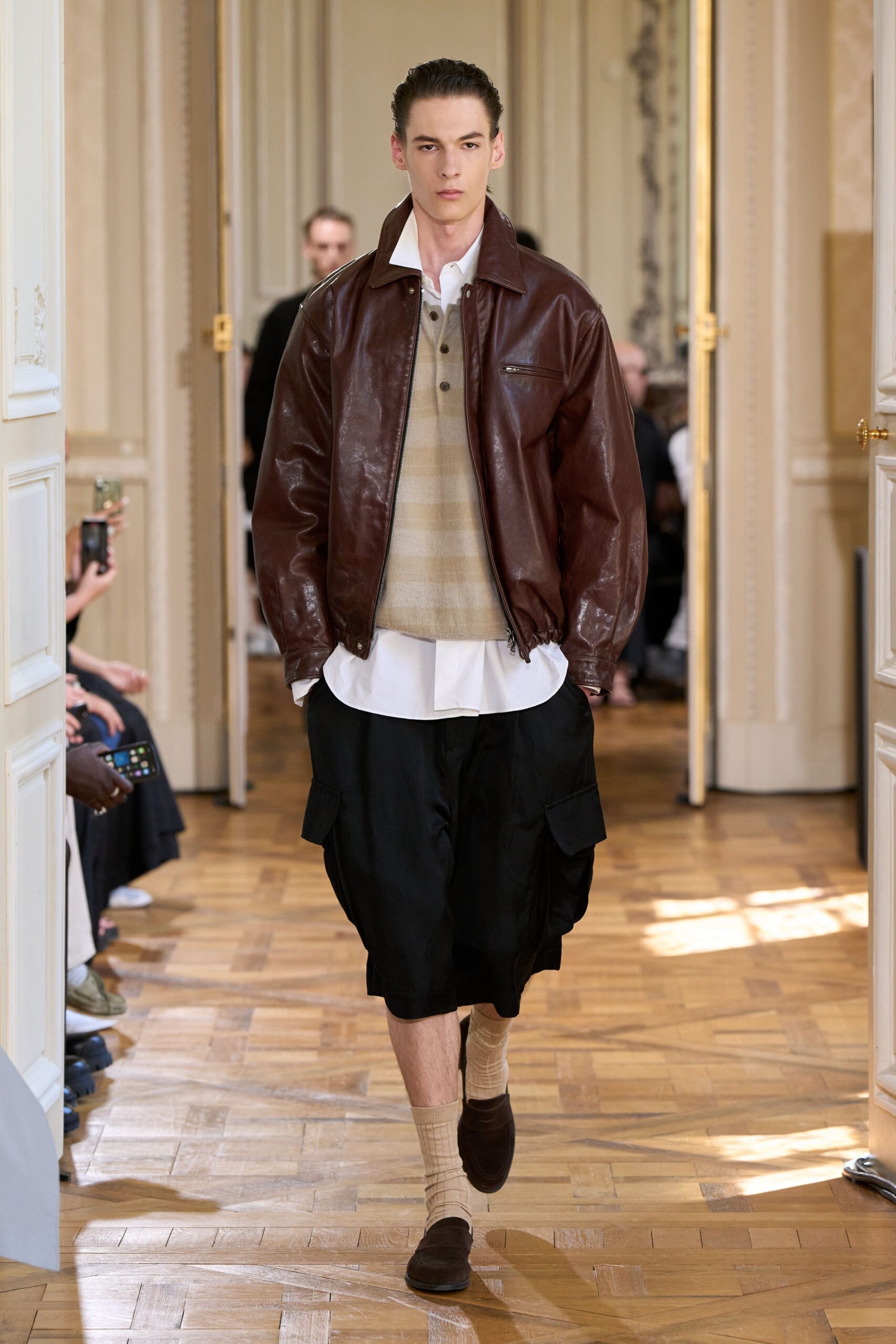 brown leather jacket with beige sweater