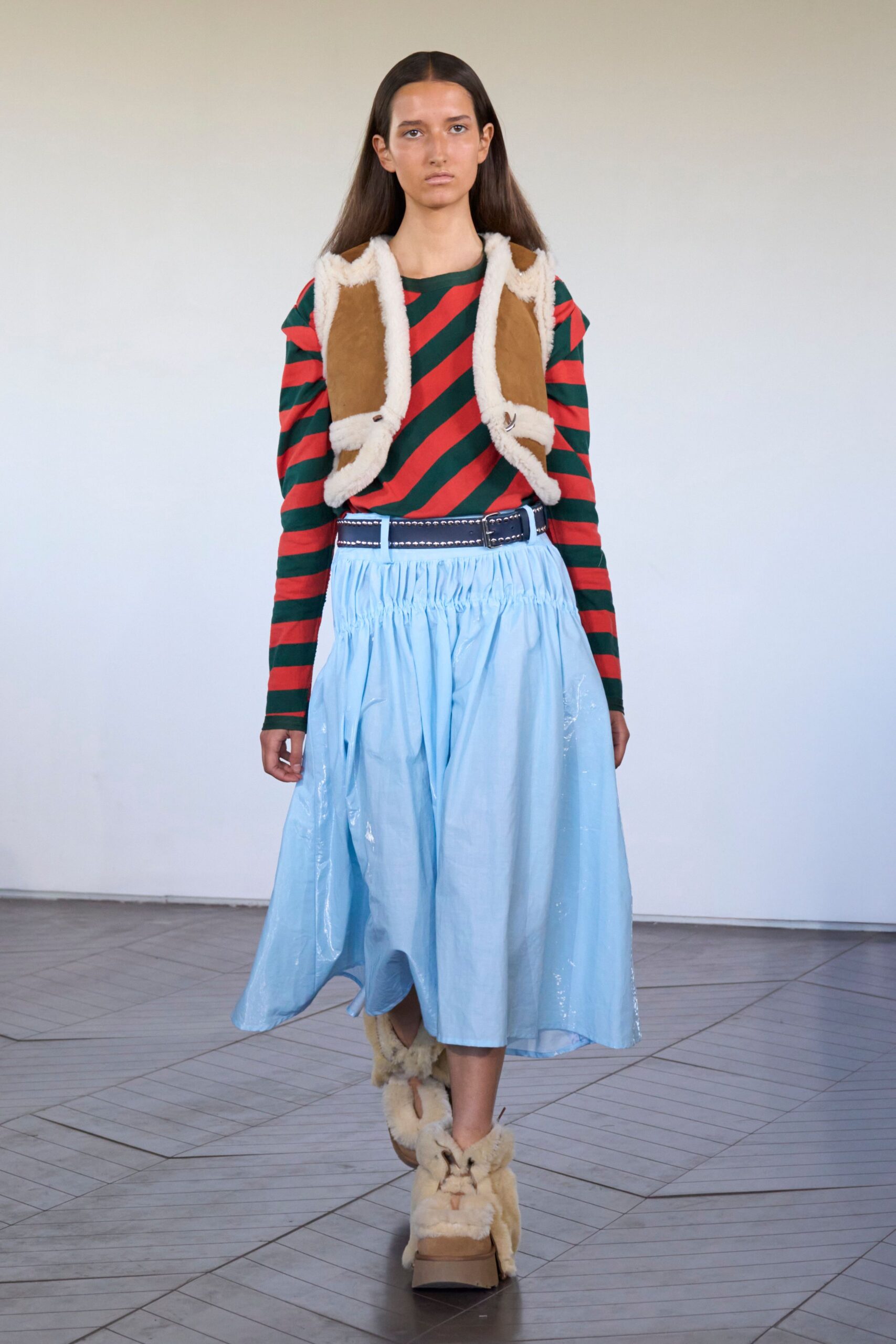 red and green striped top with blue skirt