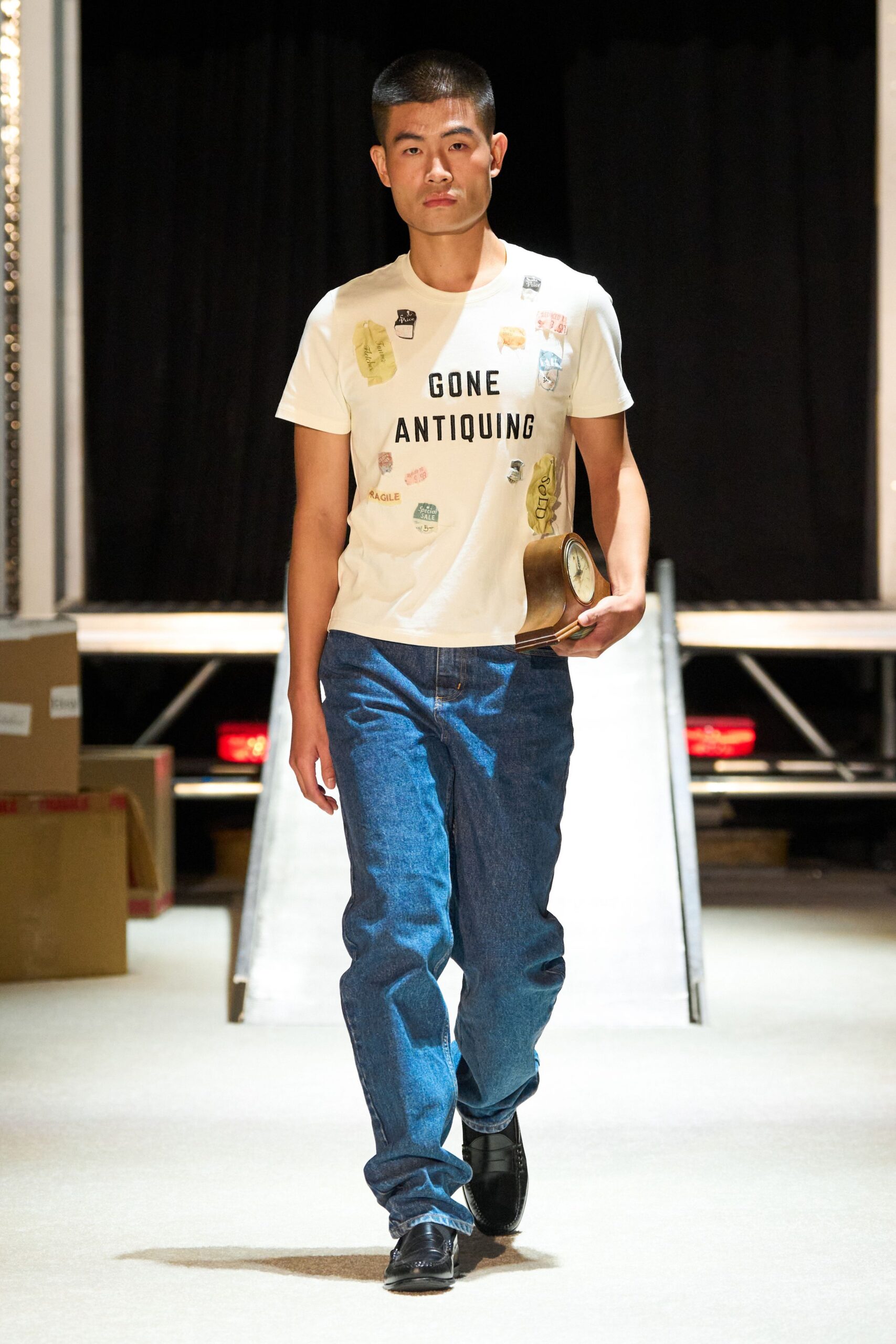 beige printed t-shirt with blue jeans