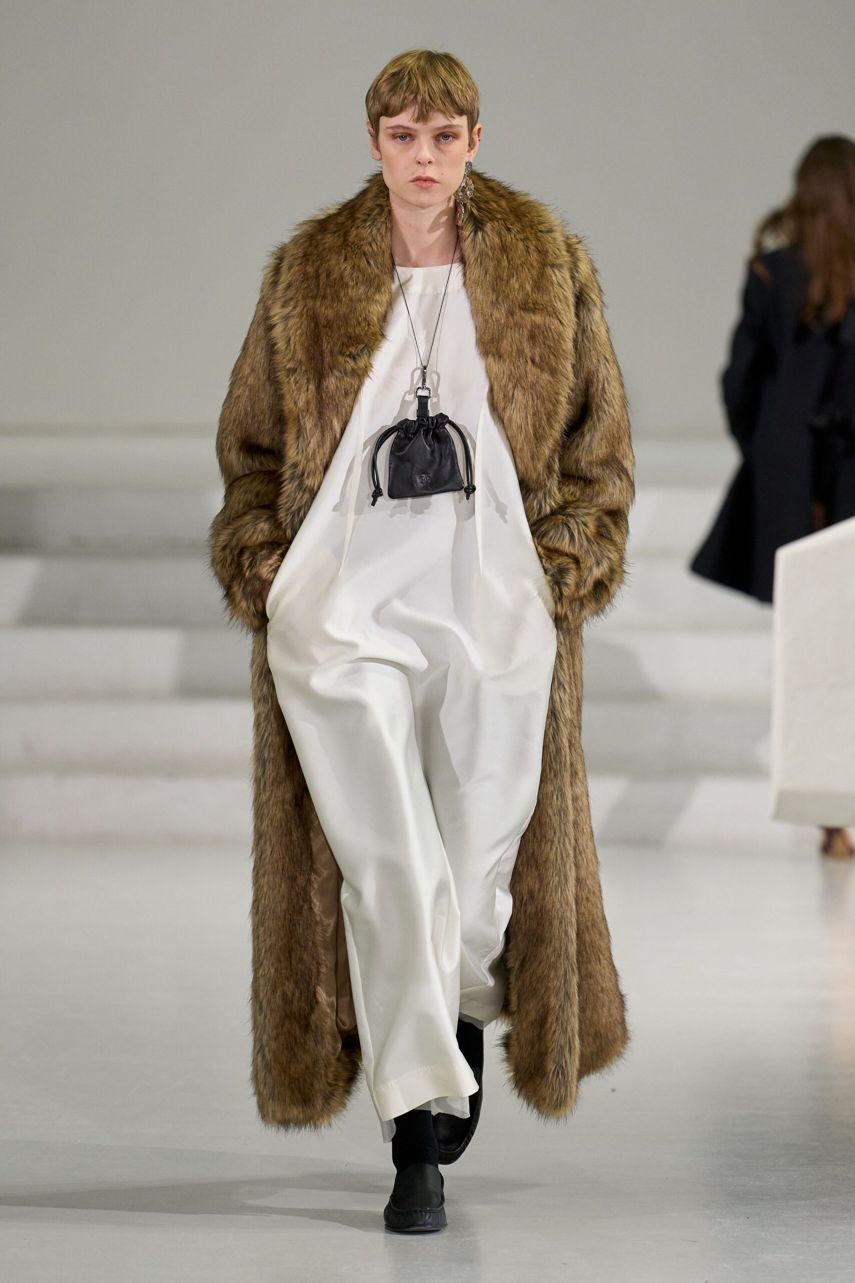 brown fur coat white jumpsuit