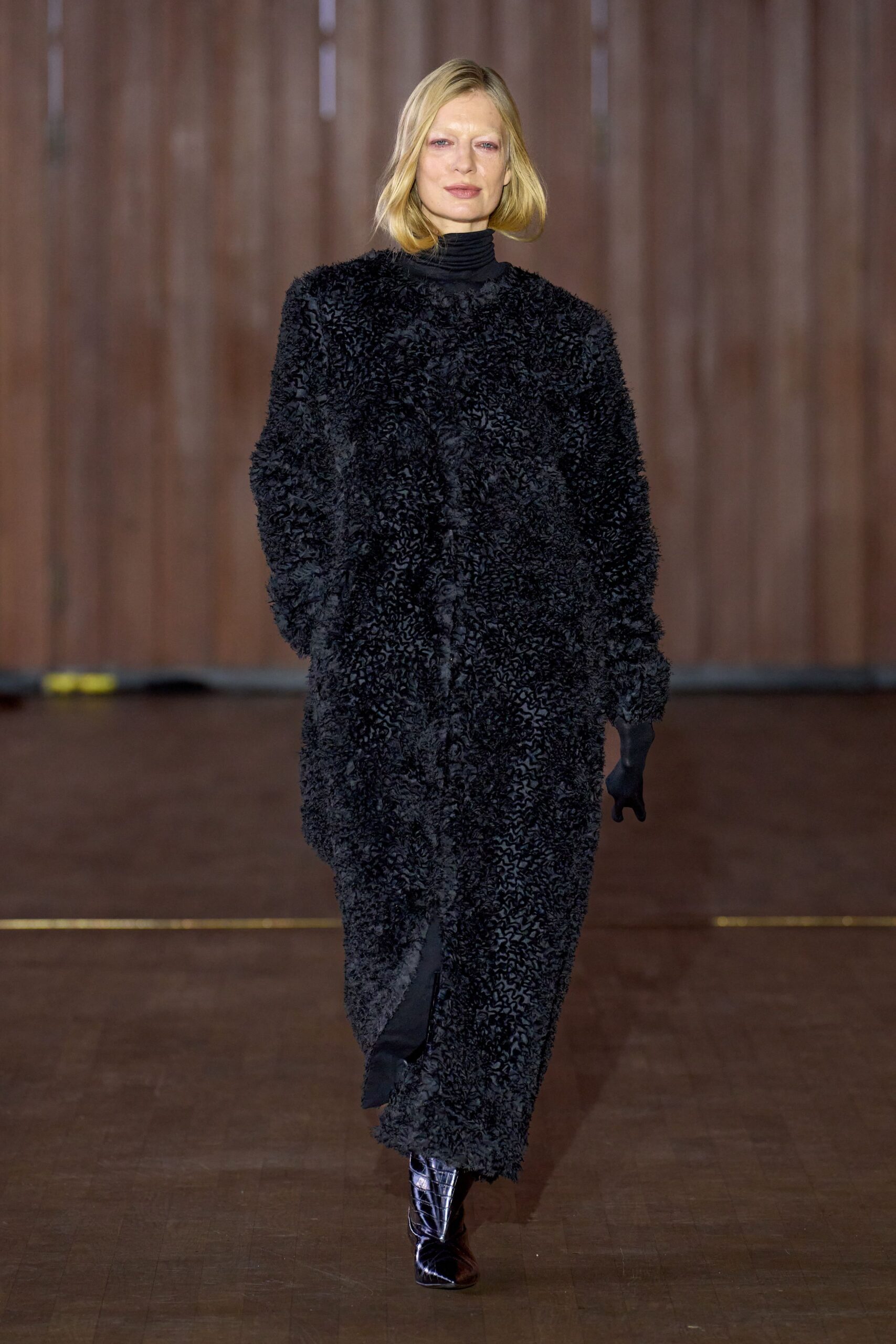 black faux-fur coat with gloves and boots