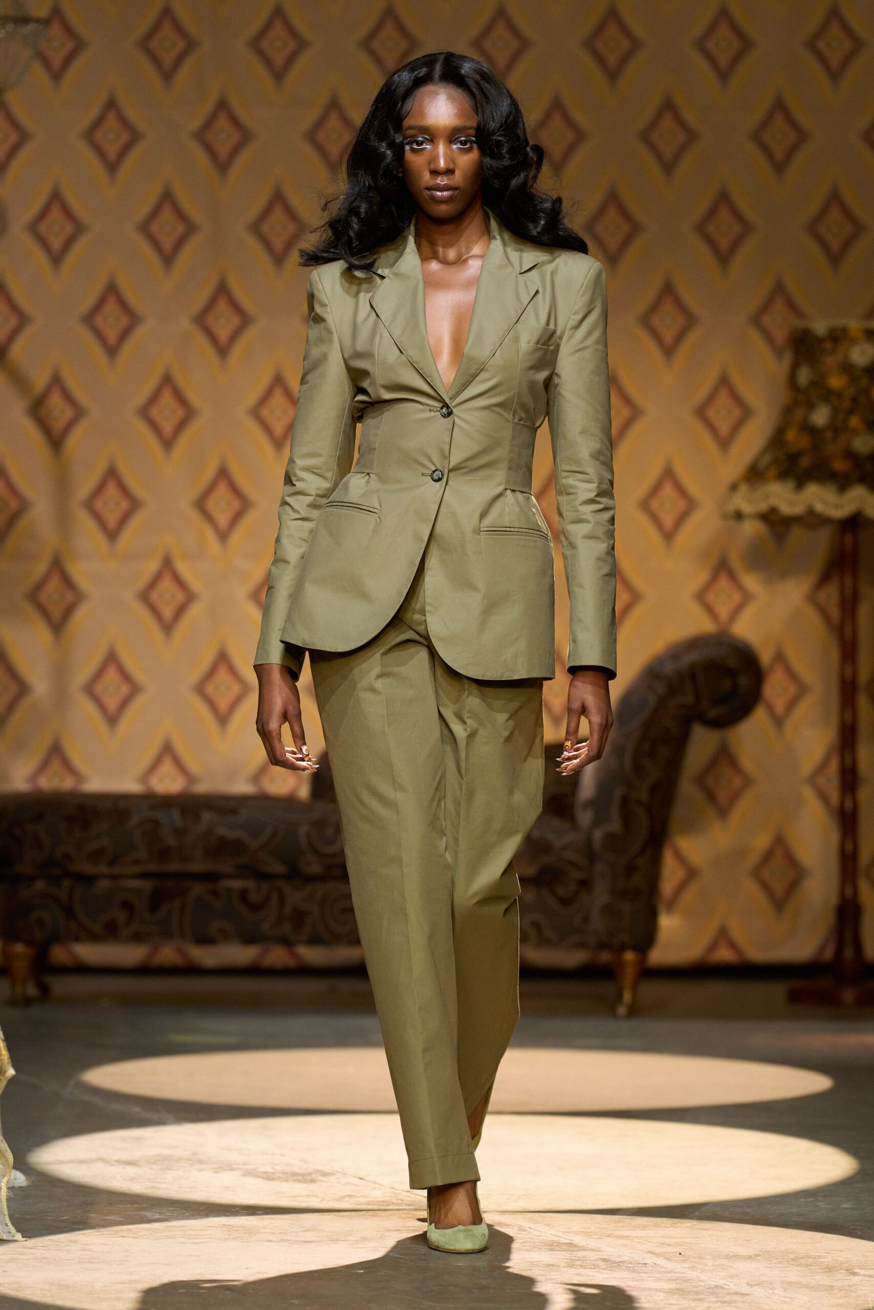 green tailored suit with heels