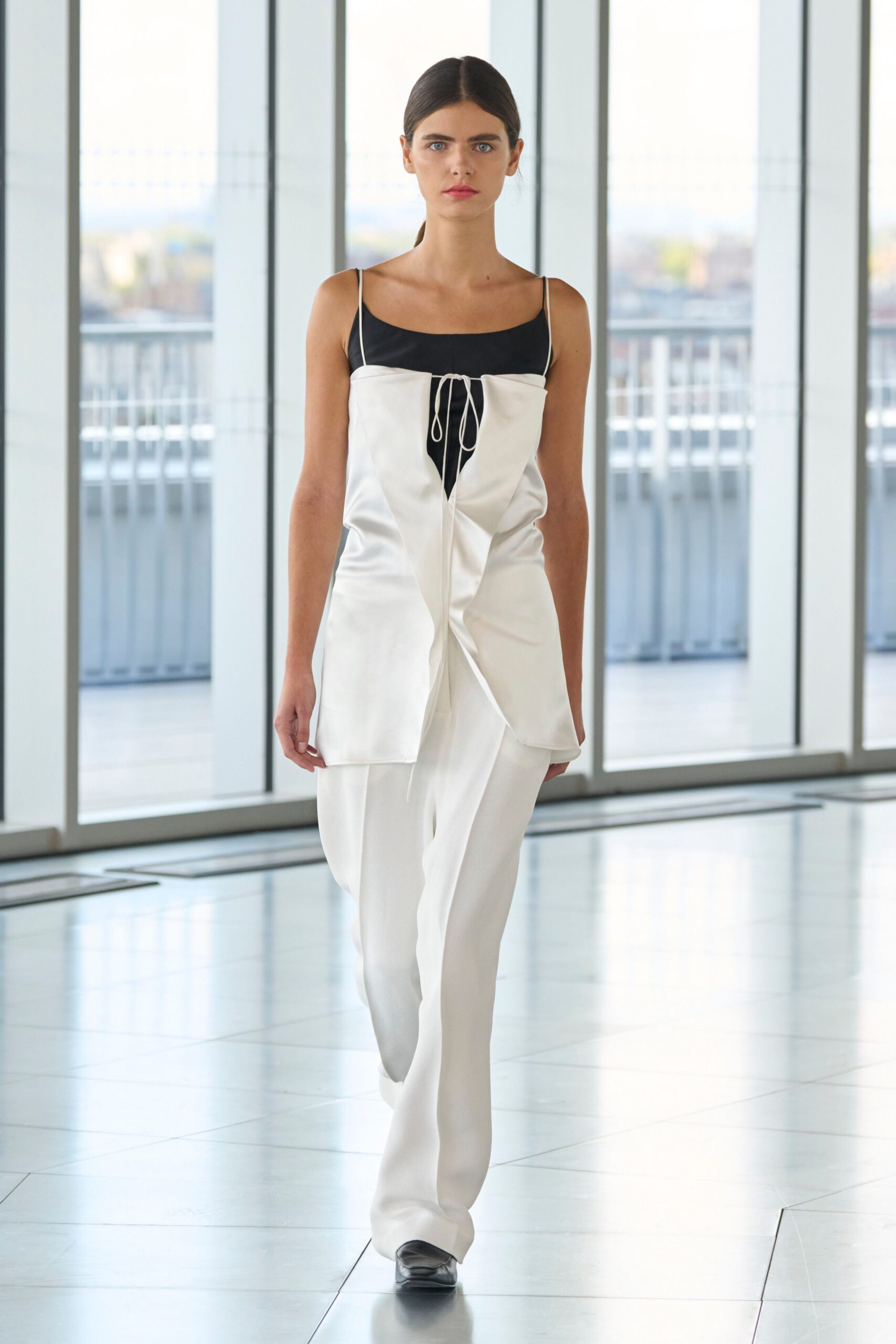 white silk sleeveless v-neck fitted buttoned top