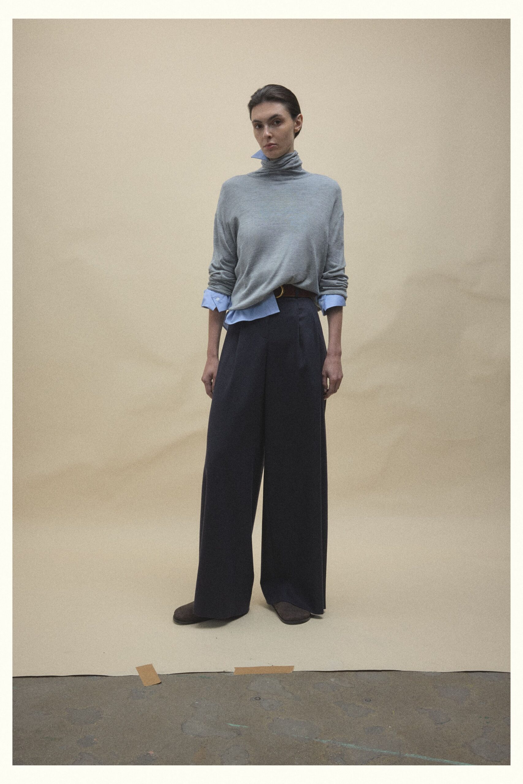 gray relaxed sweater with blue shirt