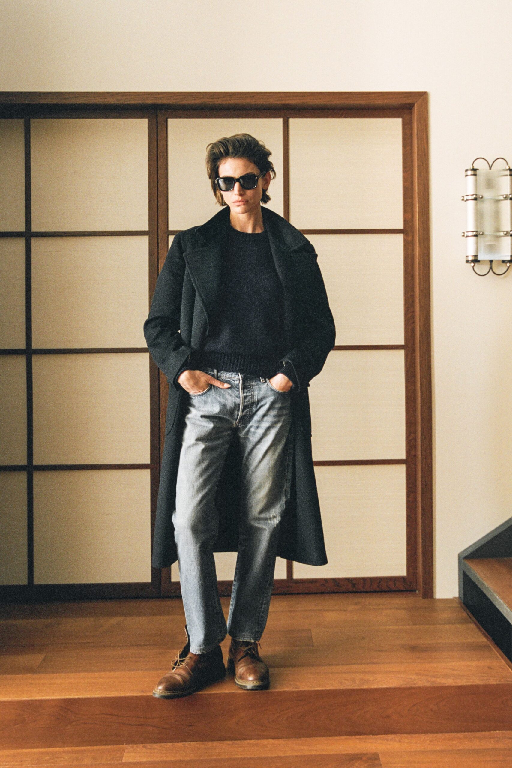 black wool long-sleeve collared structured buttoned coat