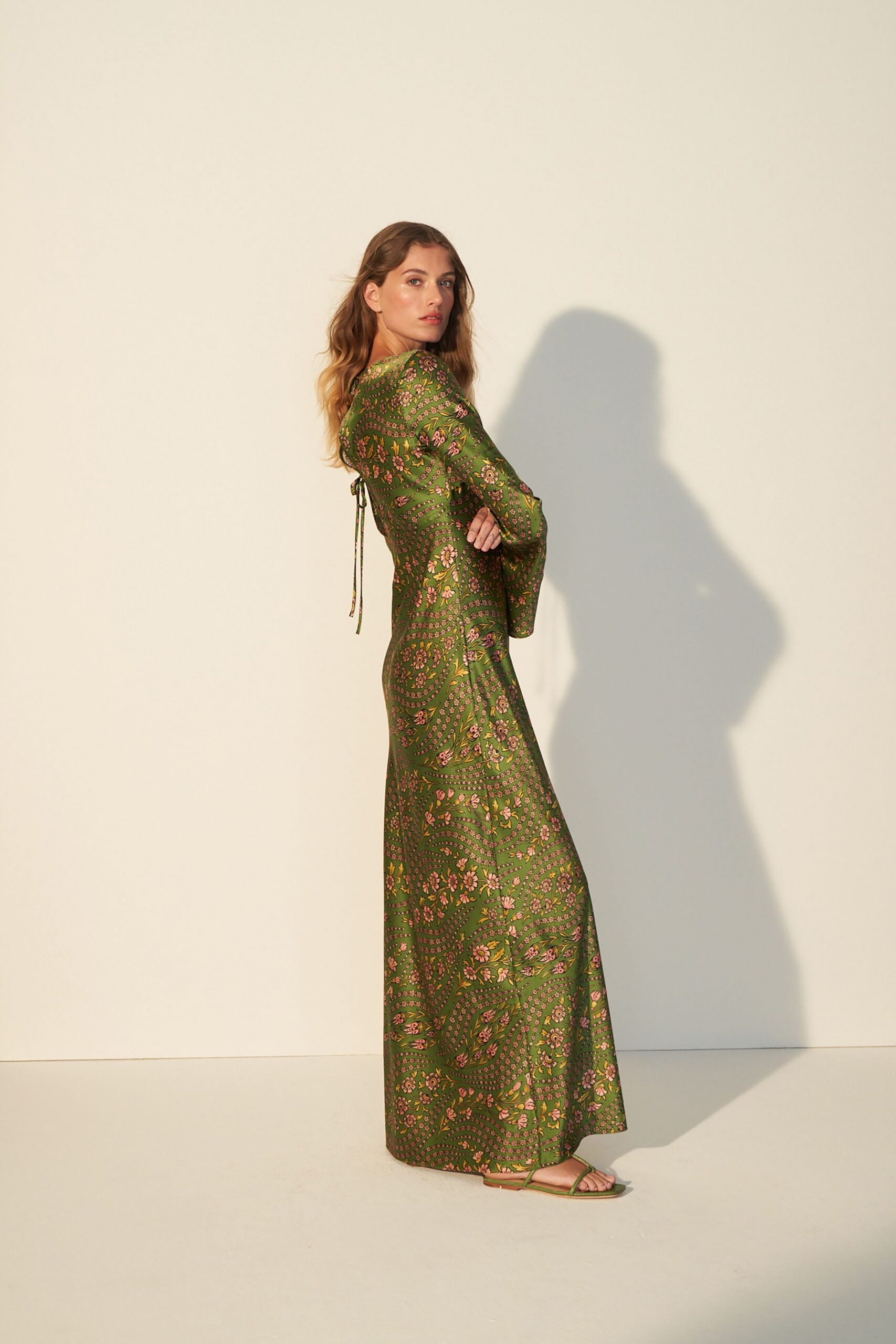 green silk long-sleeve v-neck fitted floral tiered gown