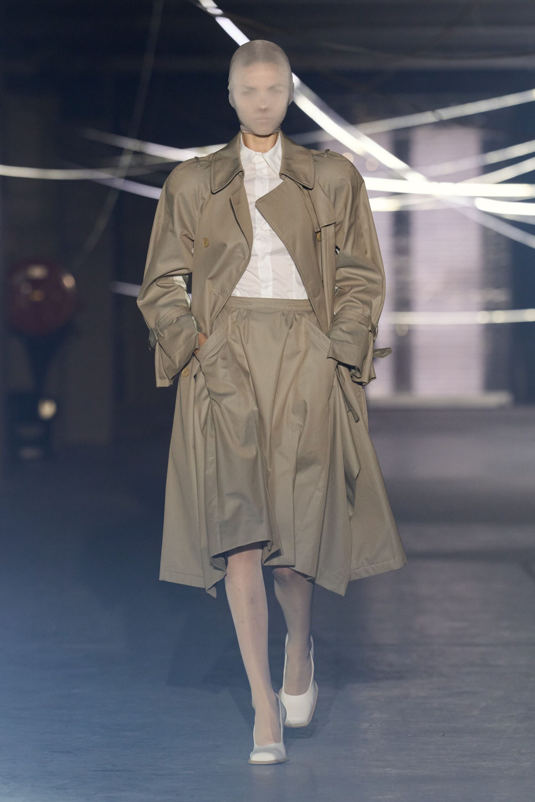 beige trench coat and white shirt