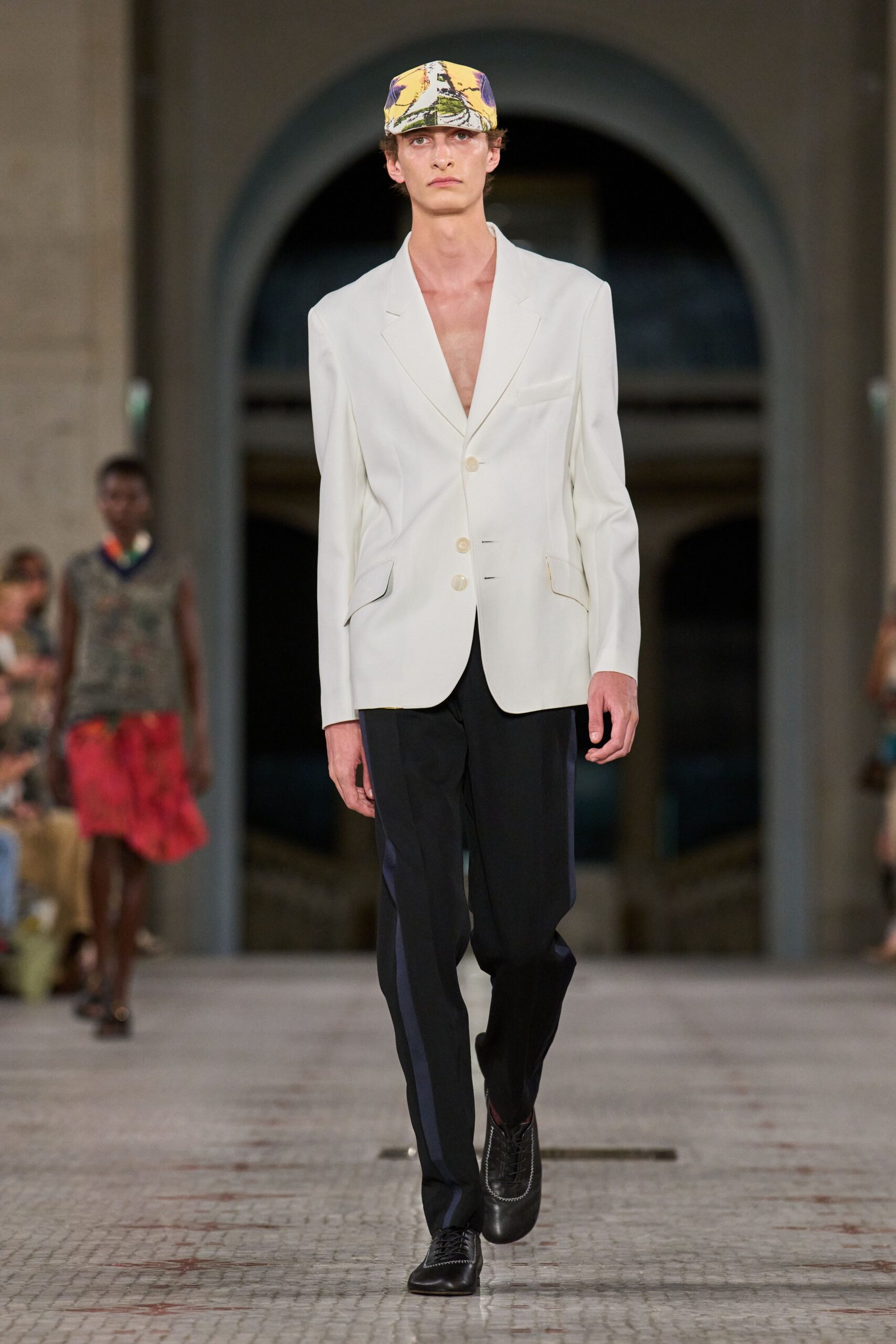 white tailored blazer with black pants
