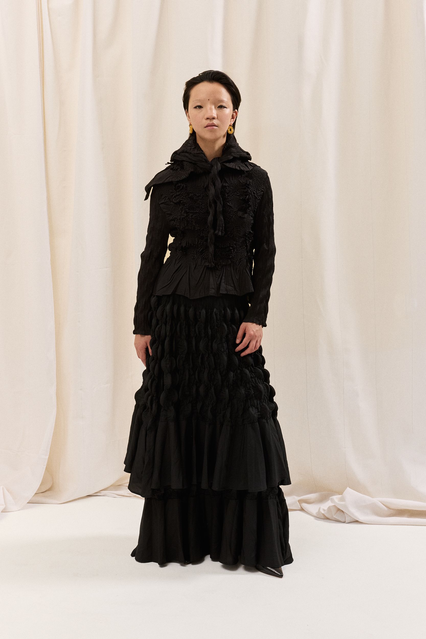 black ruffled top and tiered skirt