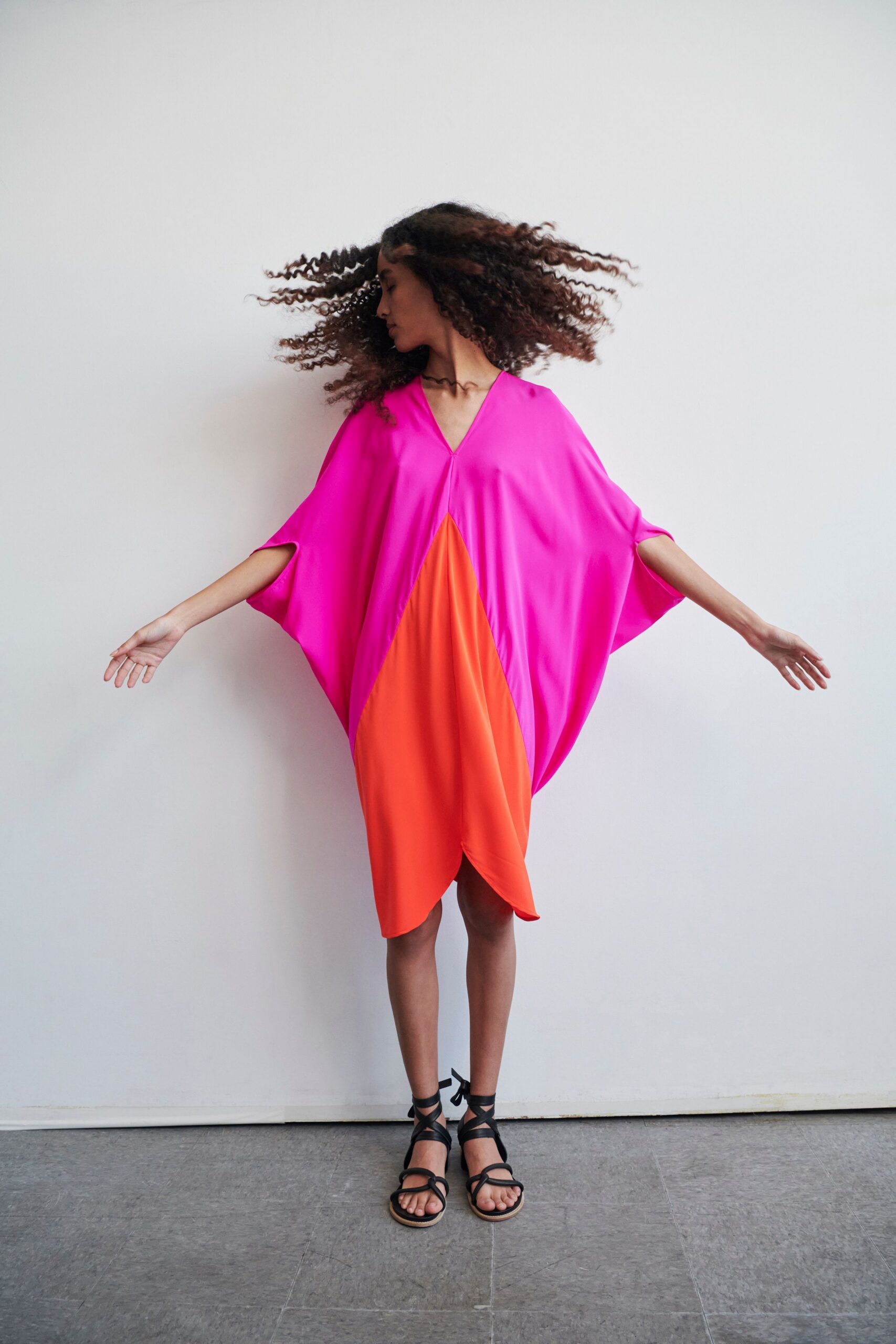 pink and orange color-blocked dress with strappy shoes