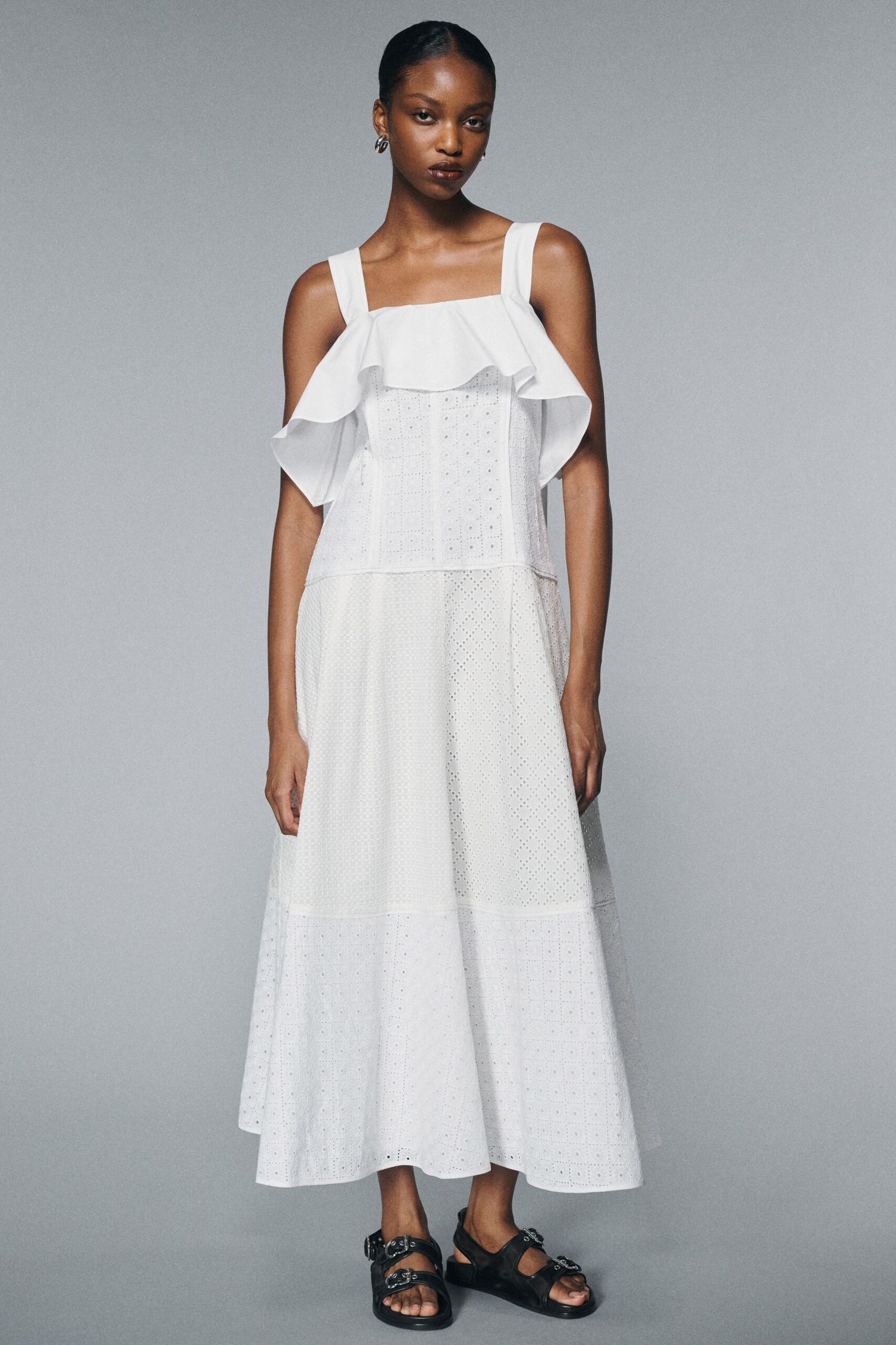 white pleated midi dress with black shoes