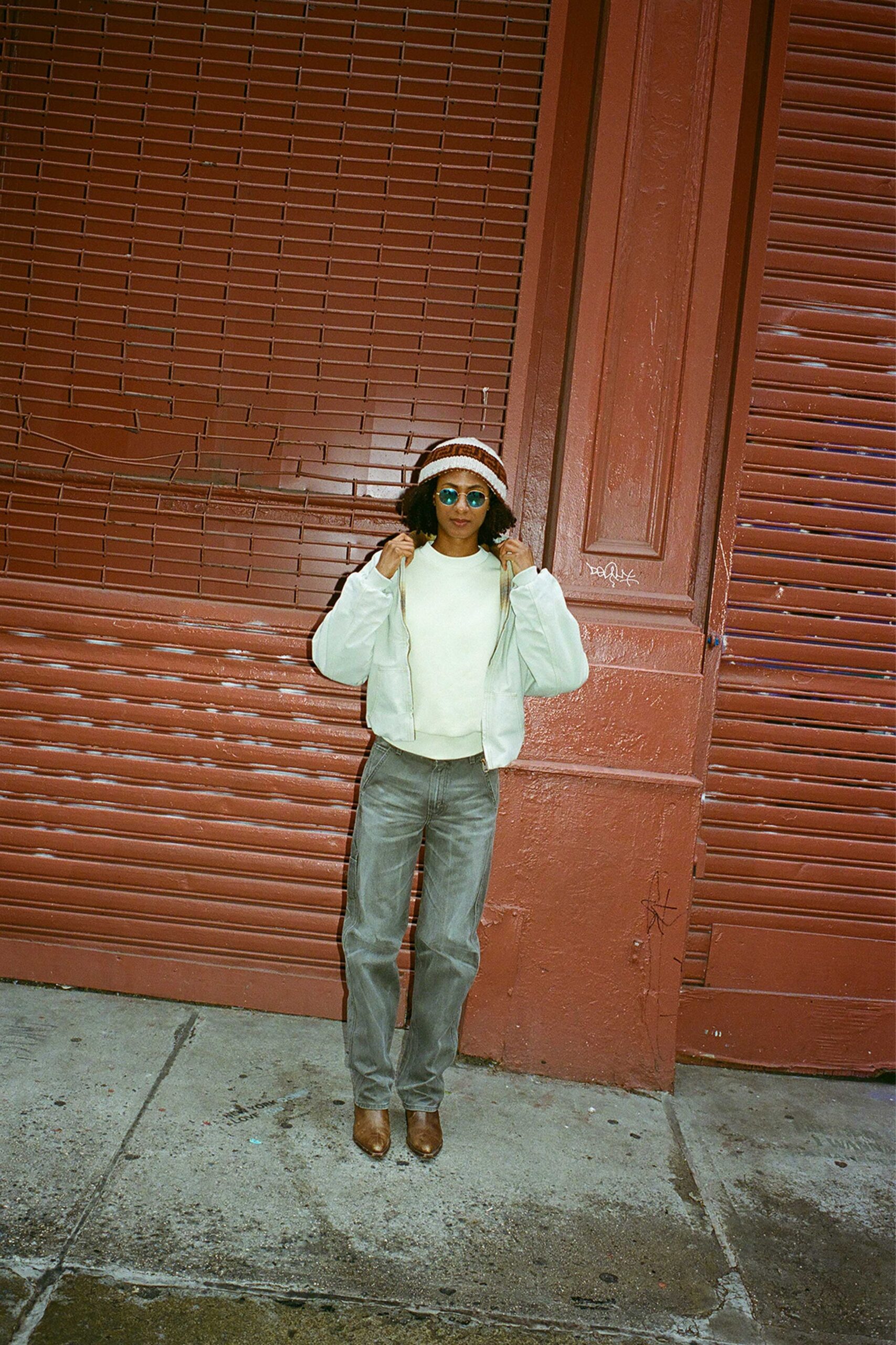white relaxed jacket with gray pants