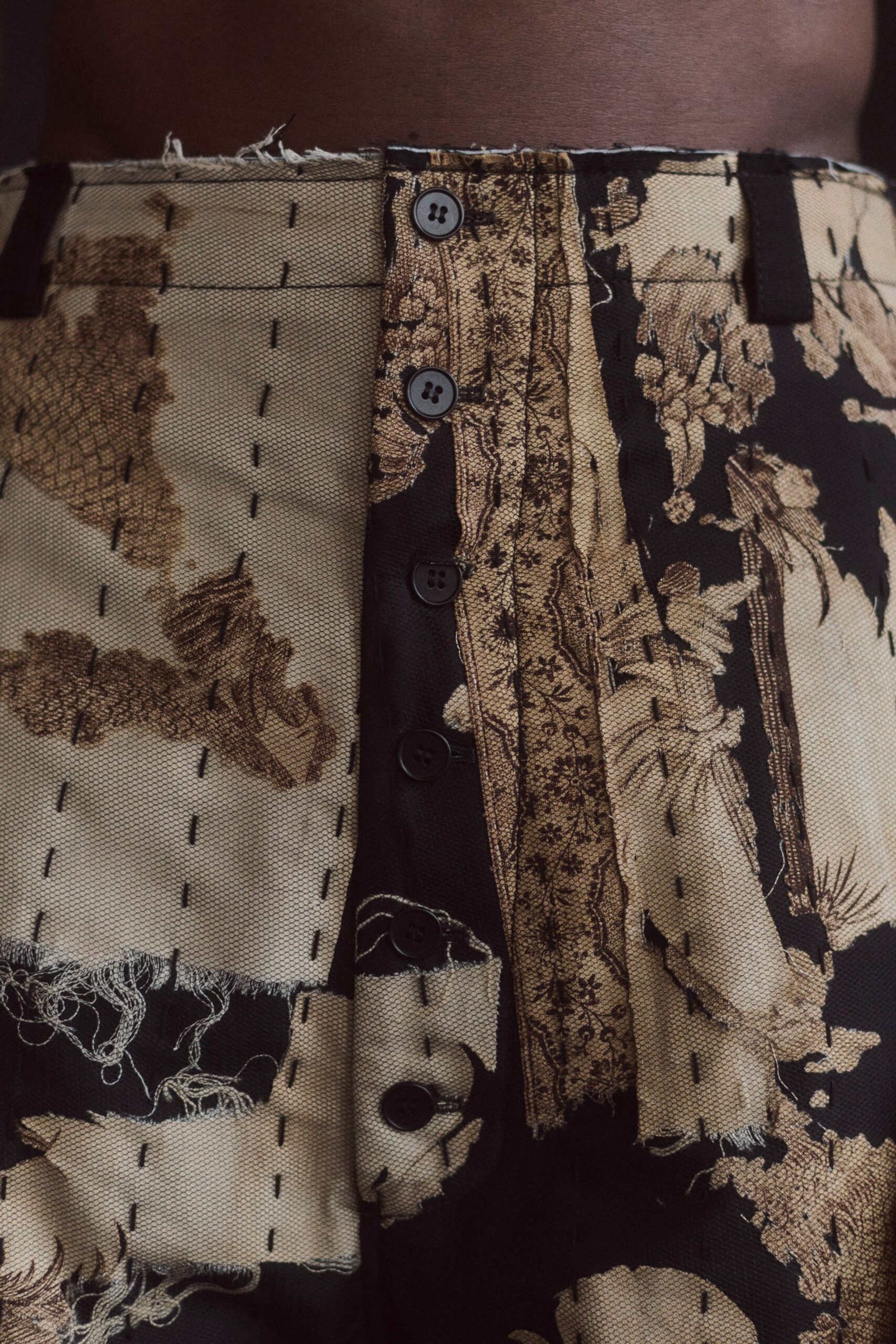 black and beige embroidered pants
