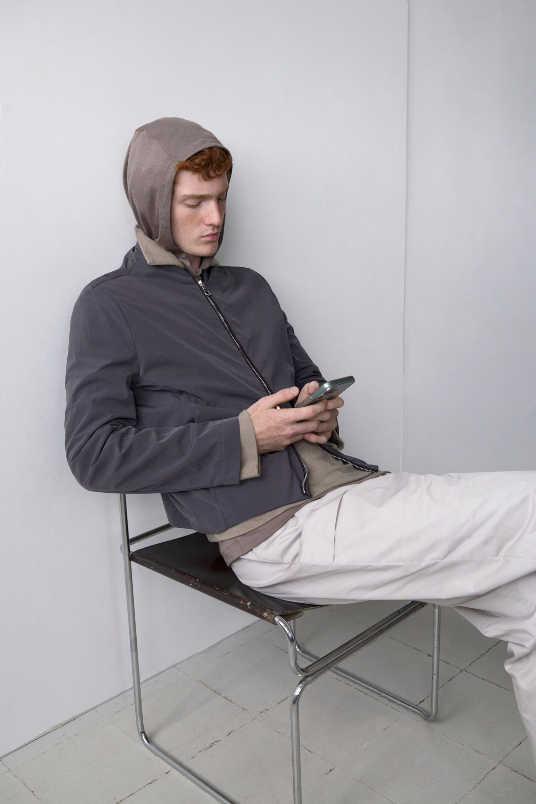 gray jacket beige hoodie white pants