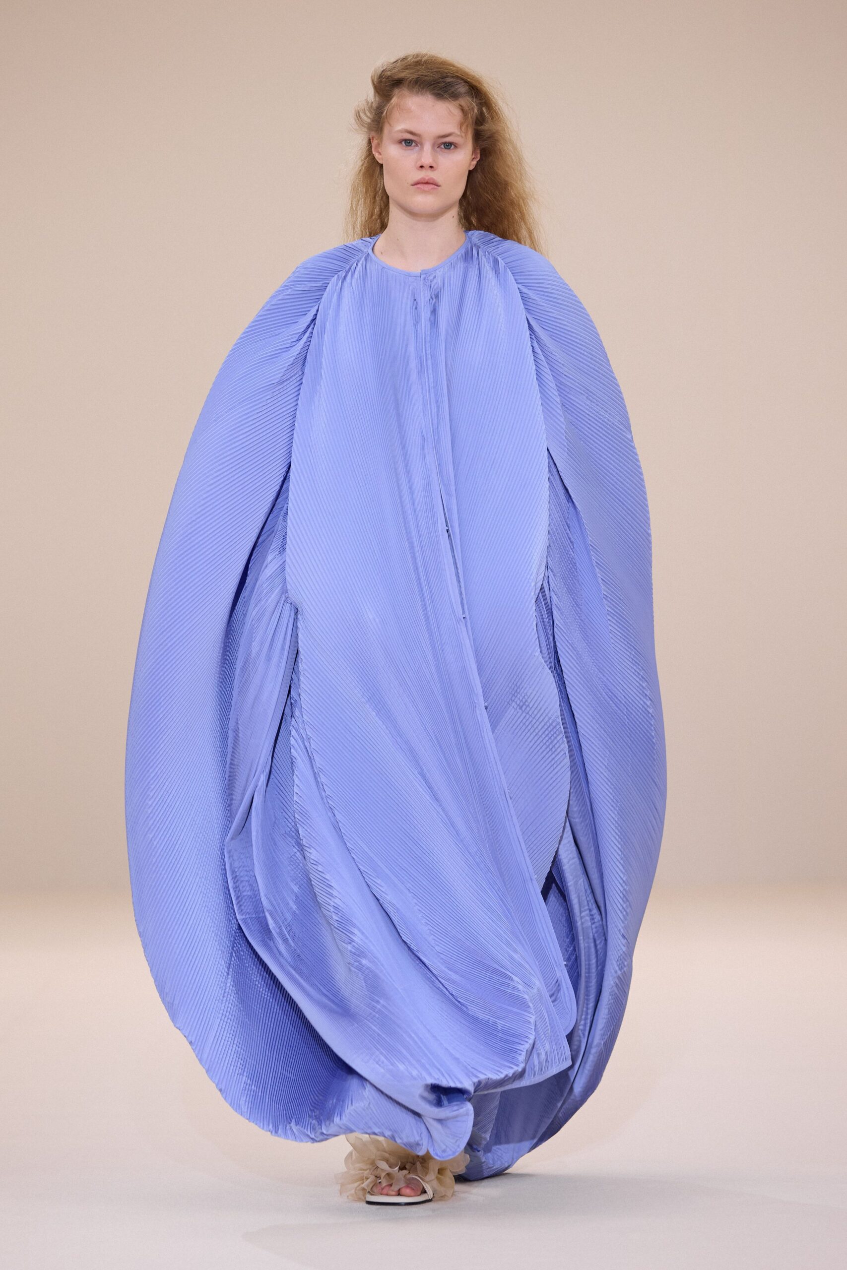 blue pleated sleeveless gown