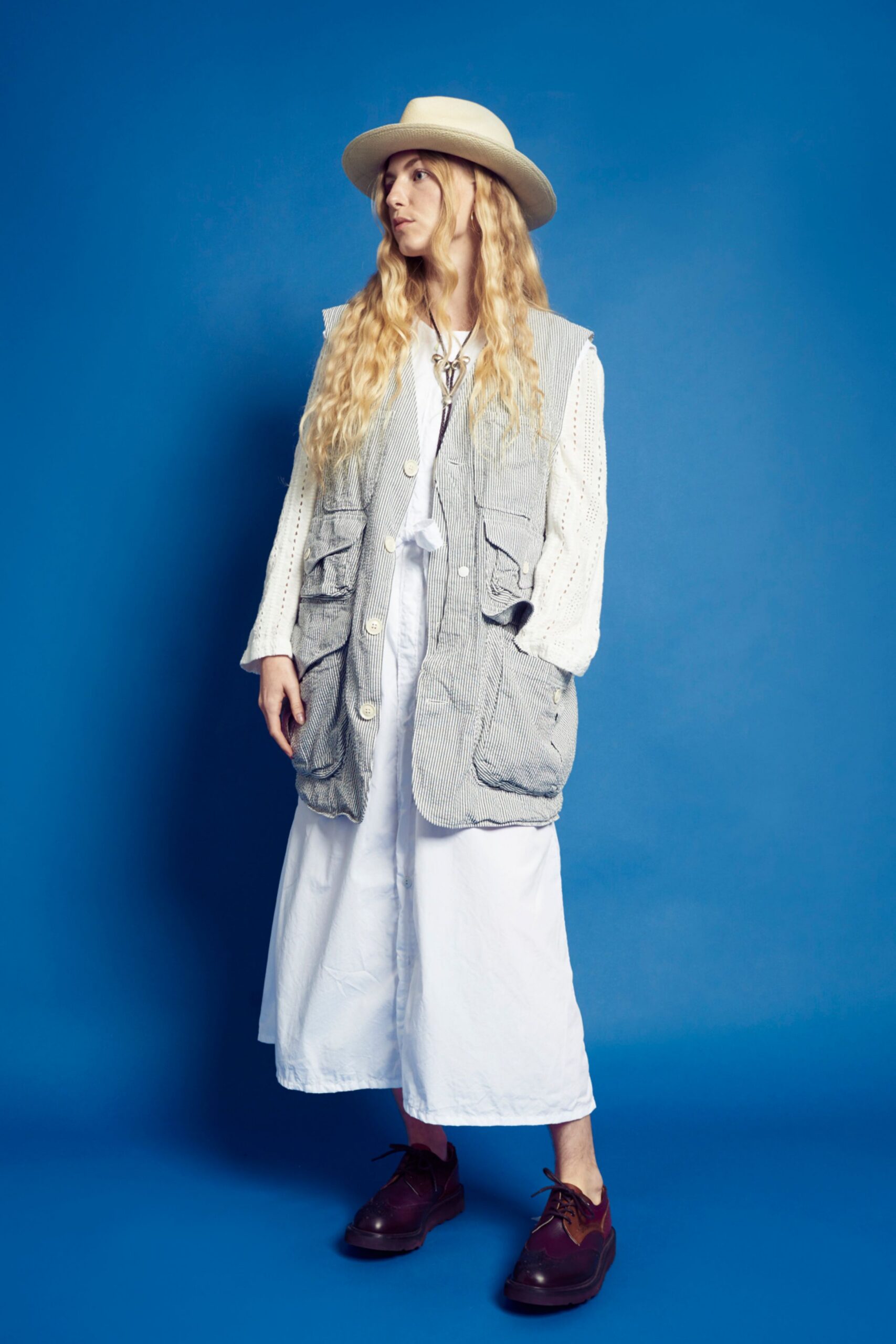 gray cotton vest over white dress