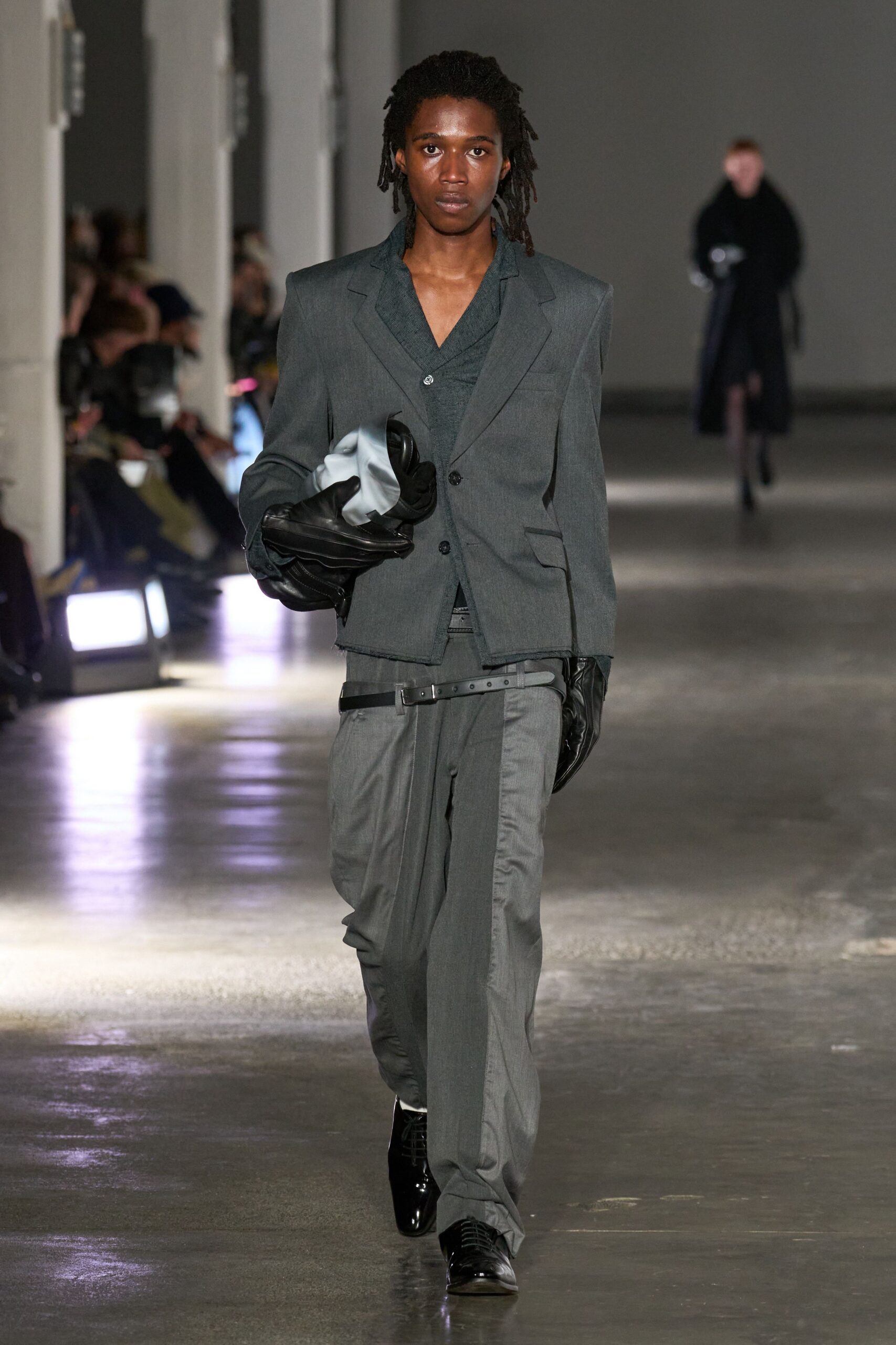 gray tailored suit with gloves
