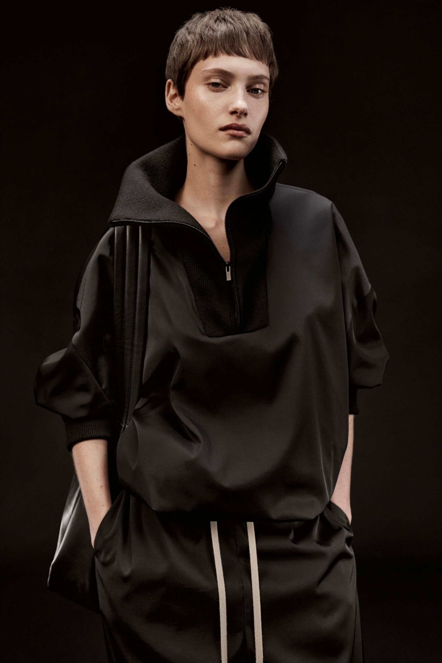black neoprene short-sleeve high-neck relaxed zippered top