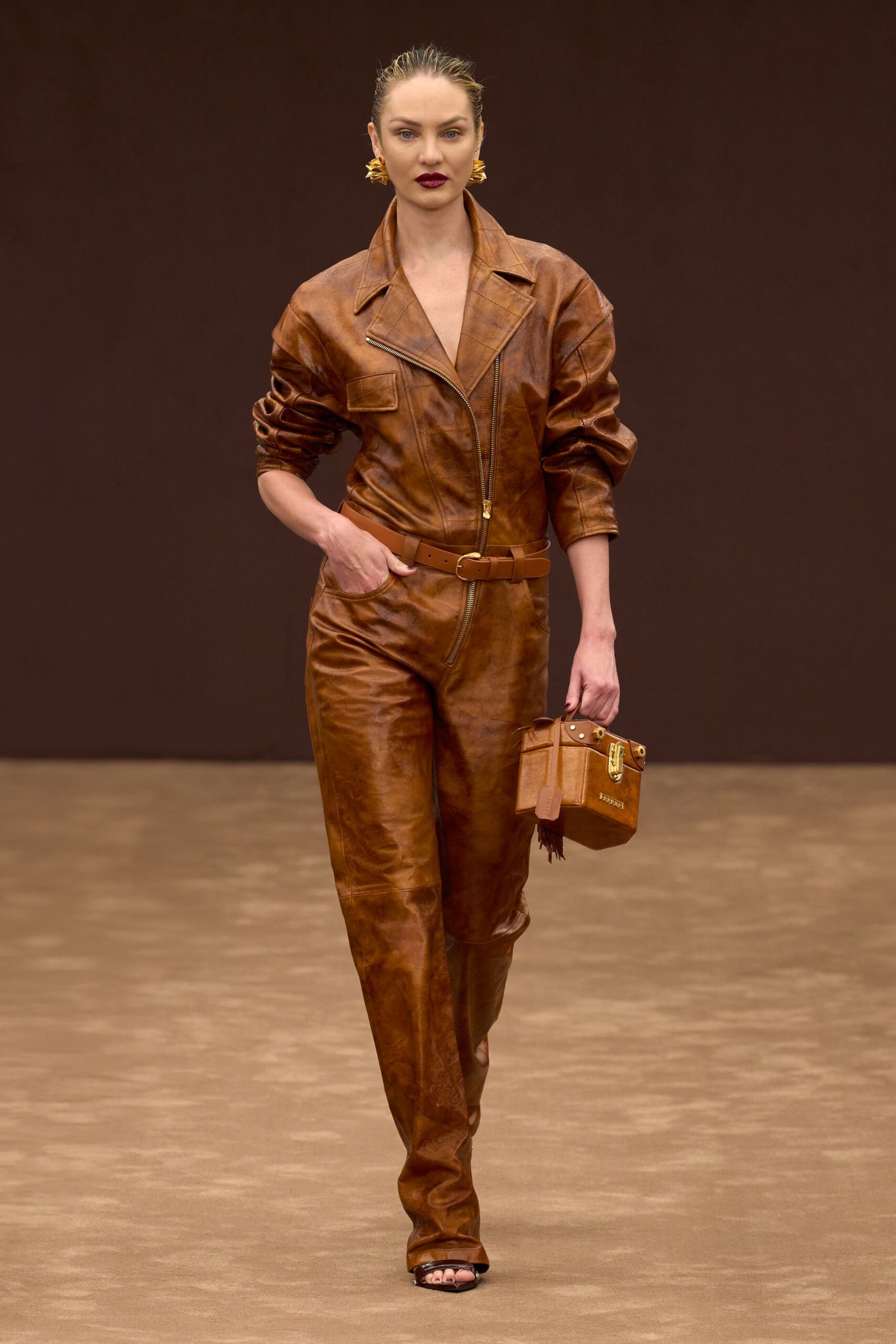 brown leather long-sleeve collared fitted zippered belted jumpsuit
