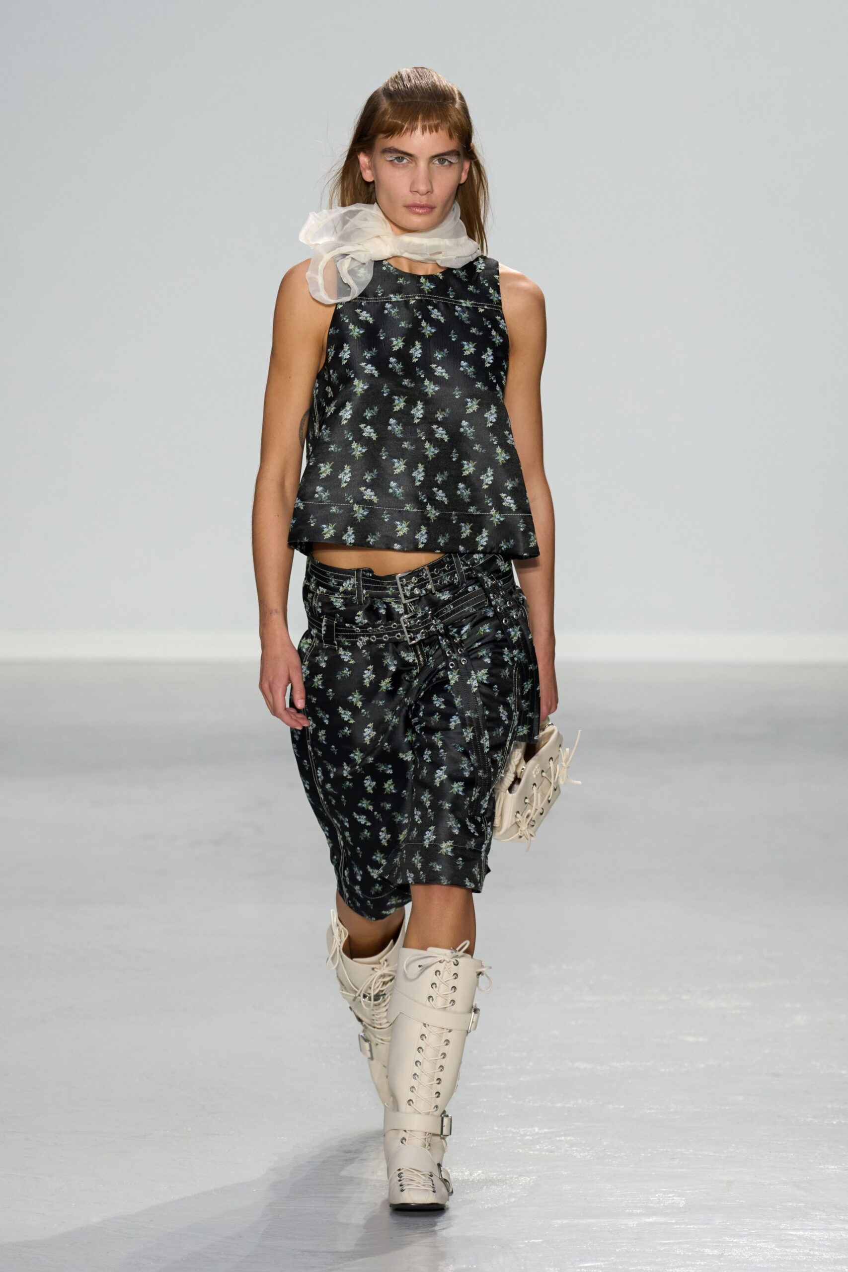 black floral top with white skirt