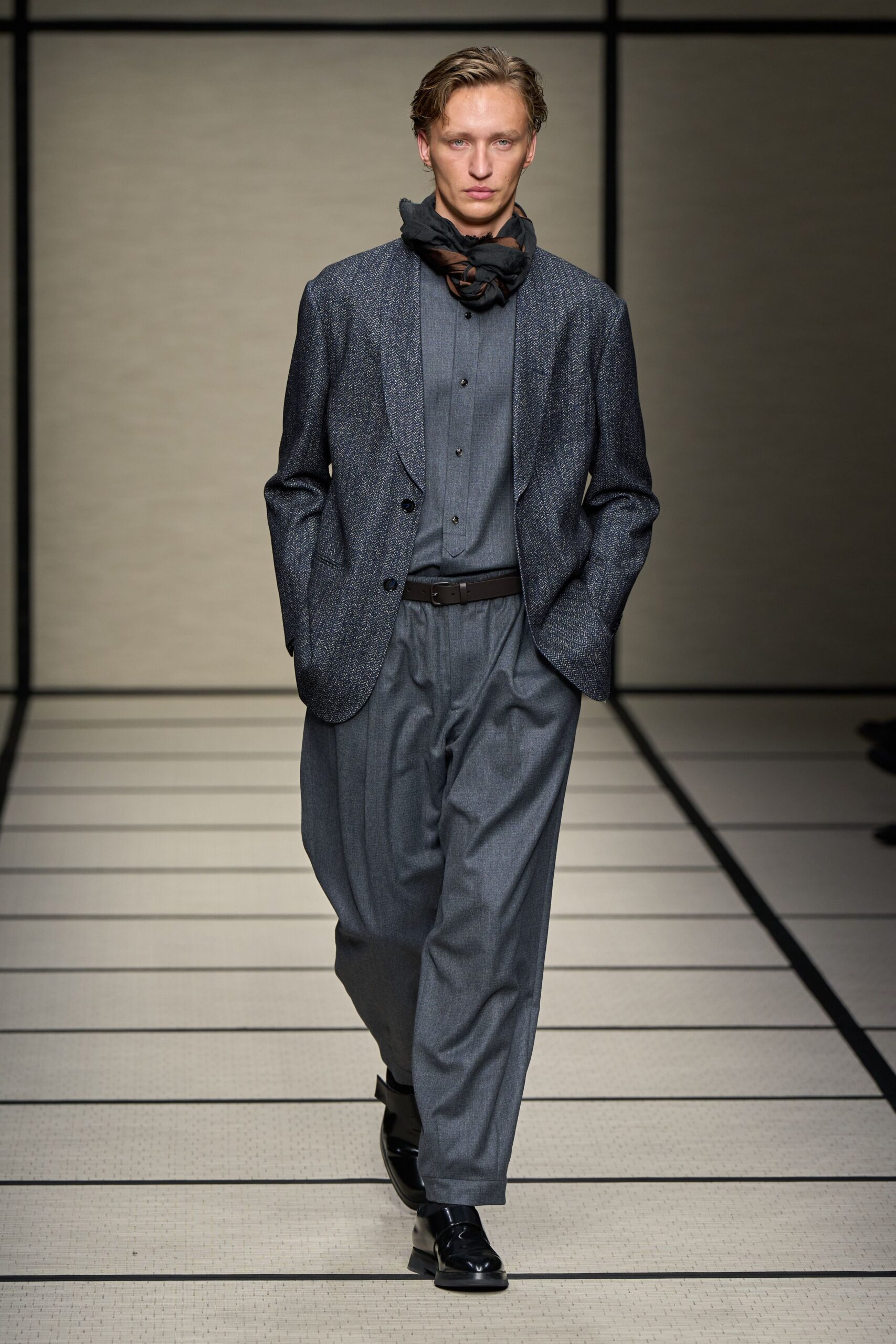 gray tailored blazer with black shirt