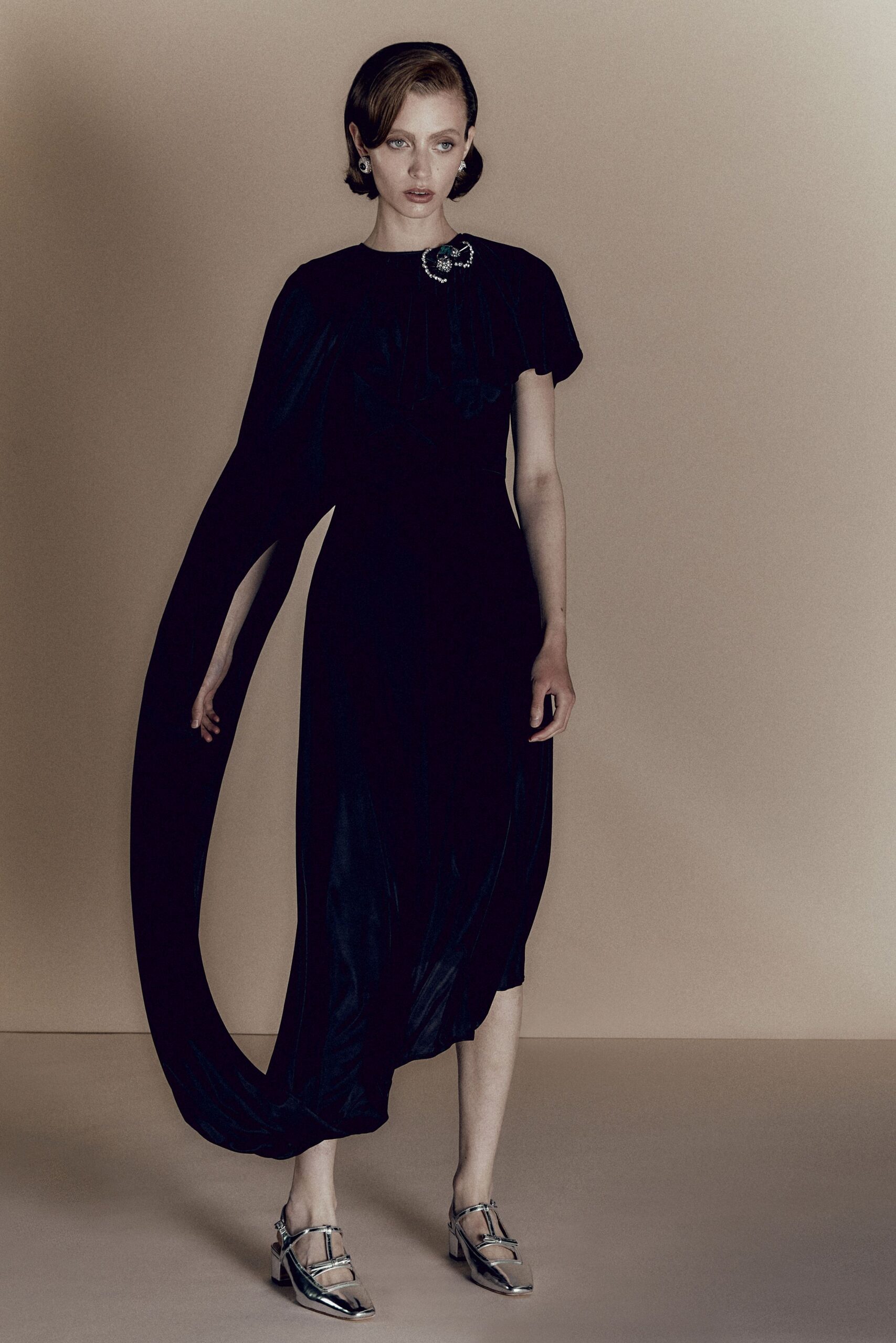 black silk sleeveless high-neck fitted draped flowing gown