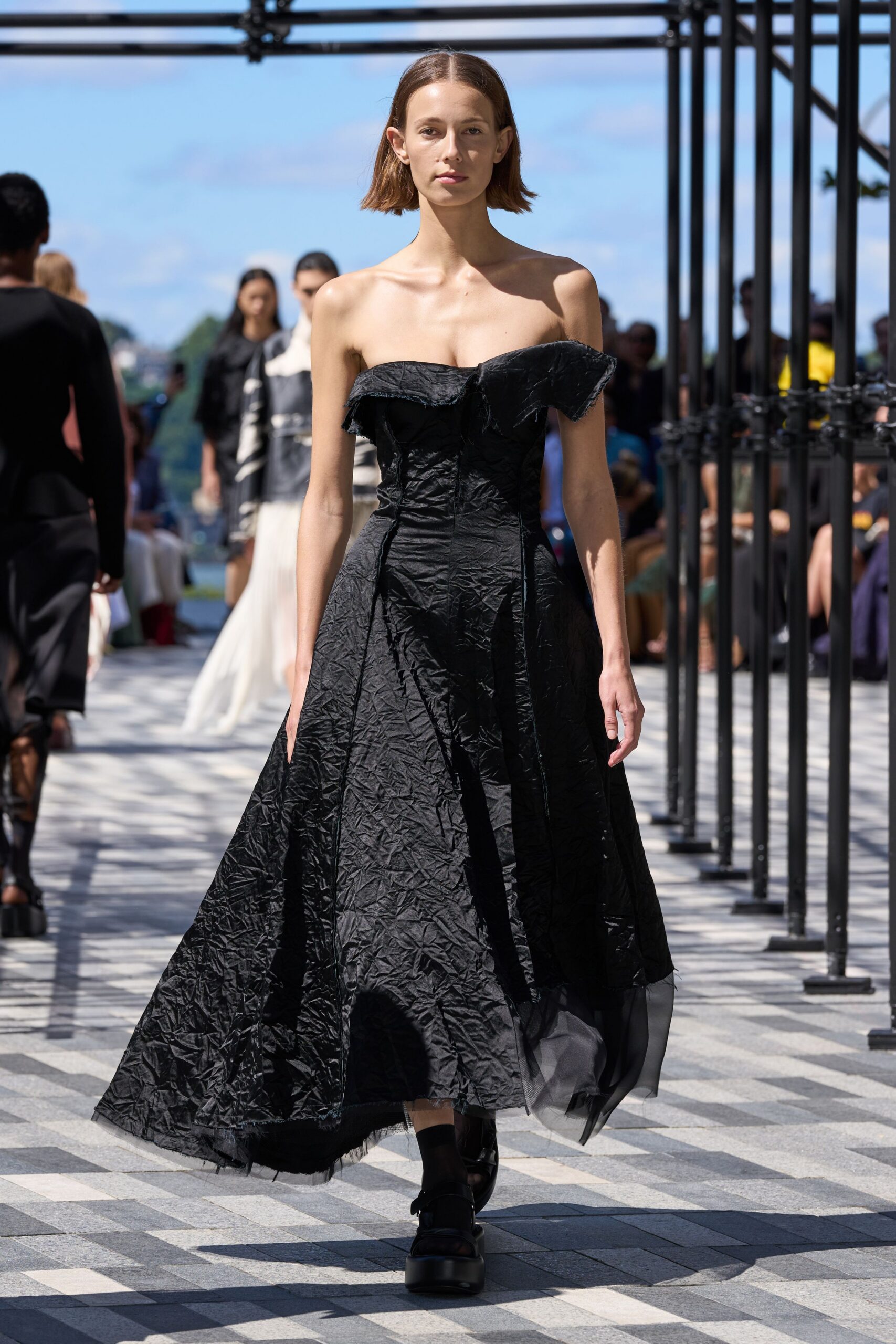 black silk strapless v-neck fitted pleated flowing gown