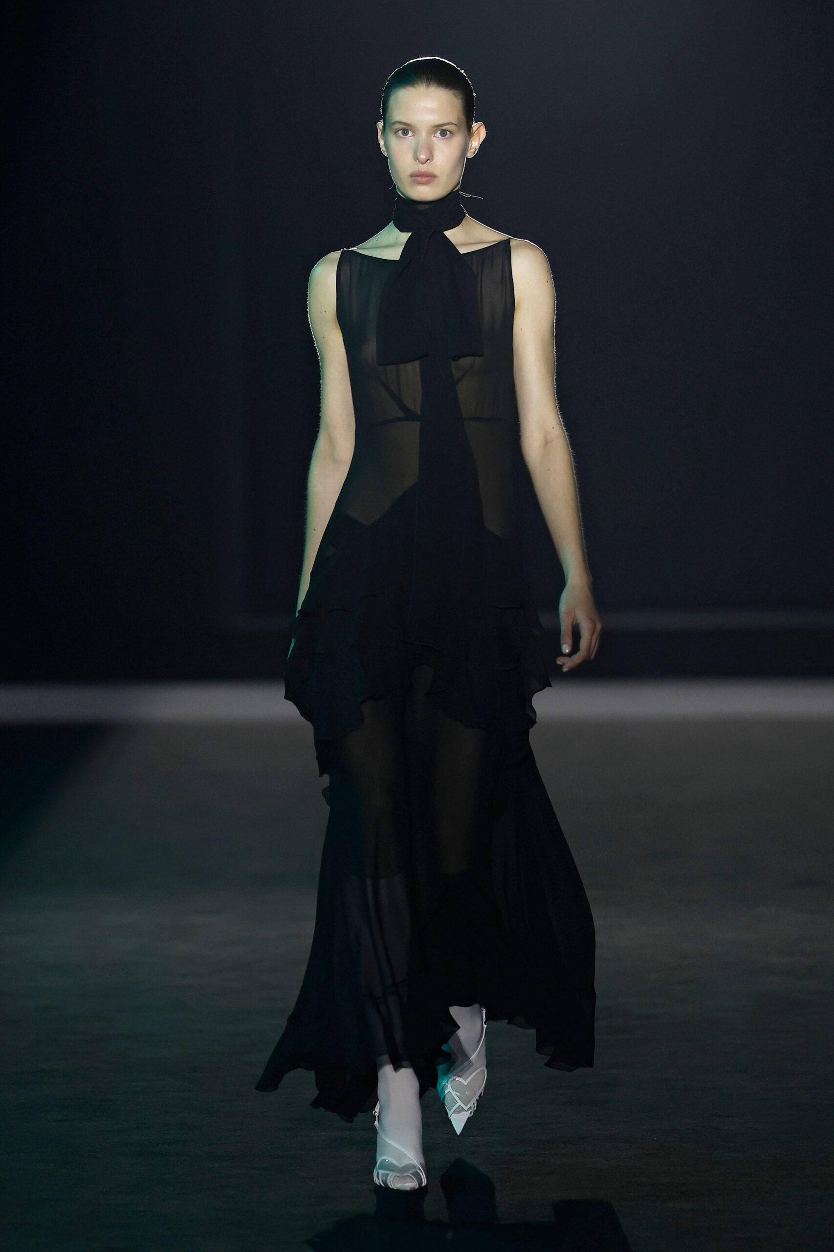black sheer ruffled maxi dress with white shoes