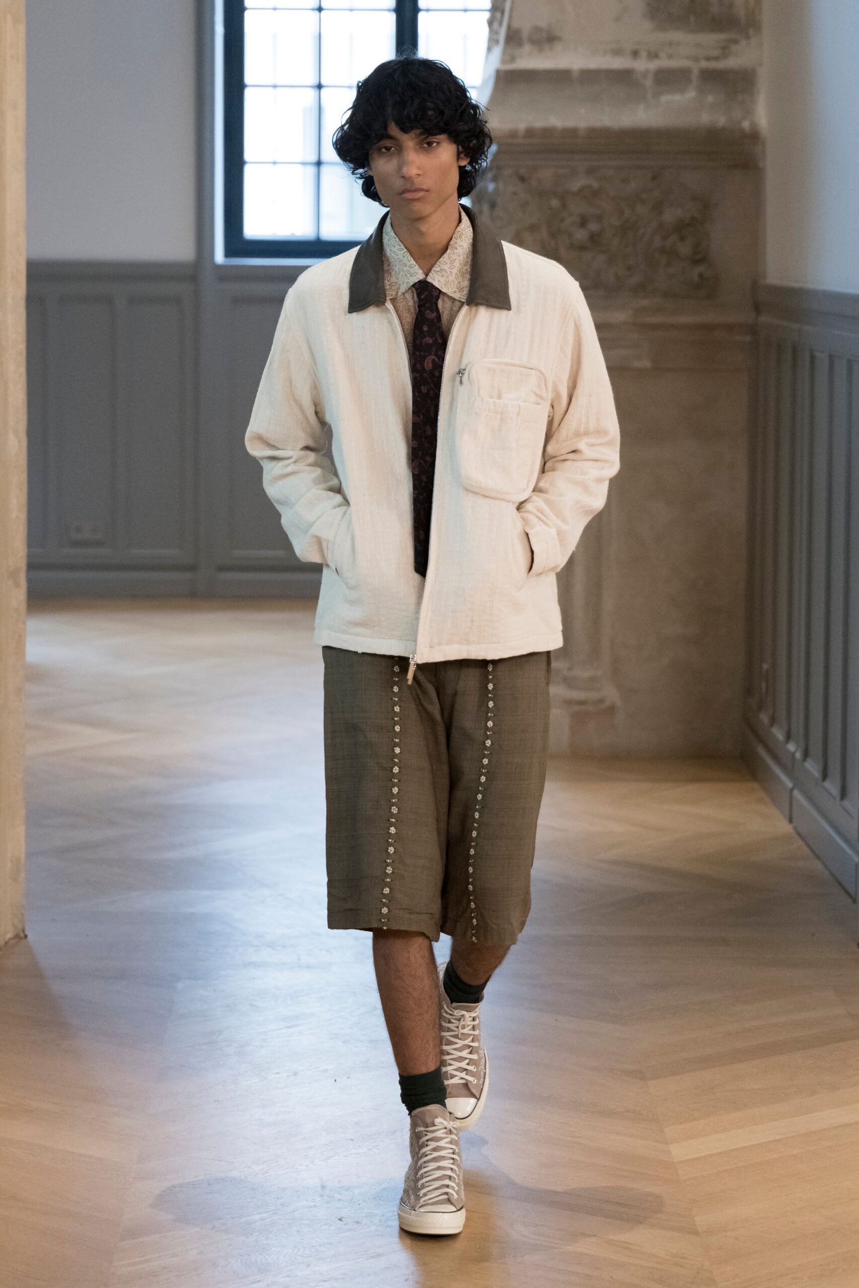 relaxed white jacket with brown shorts