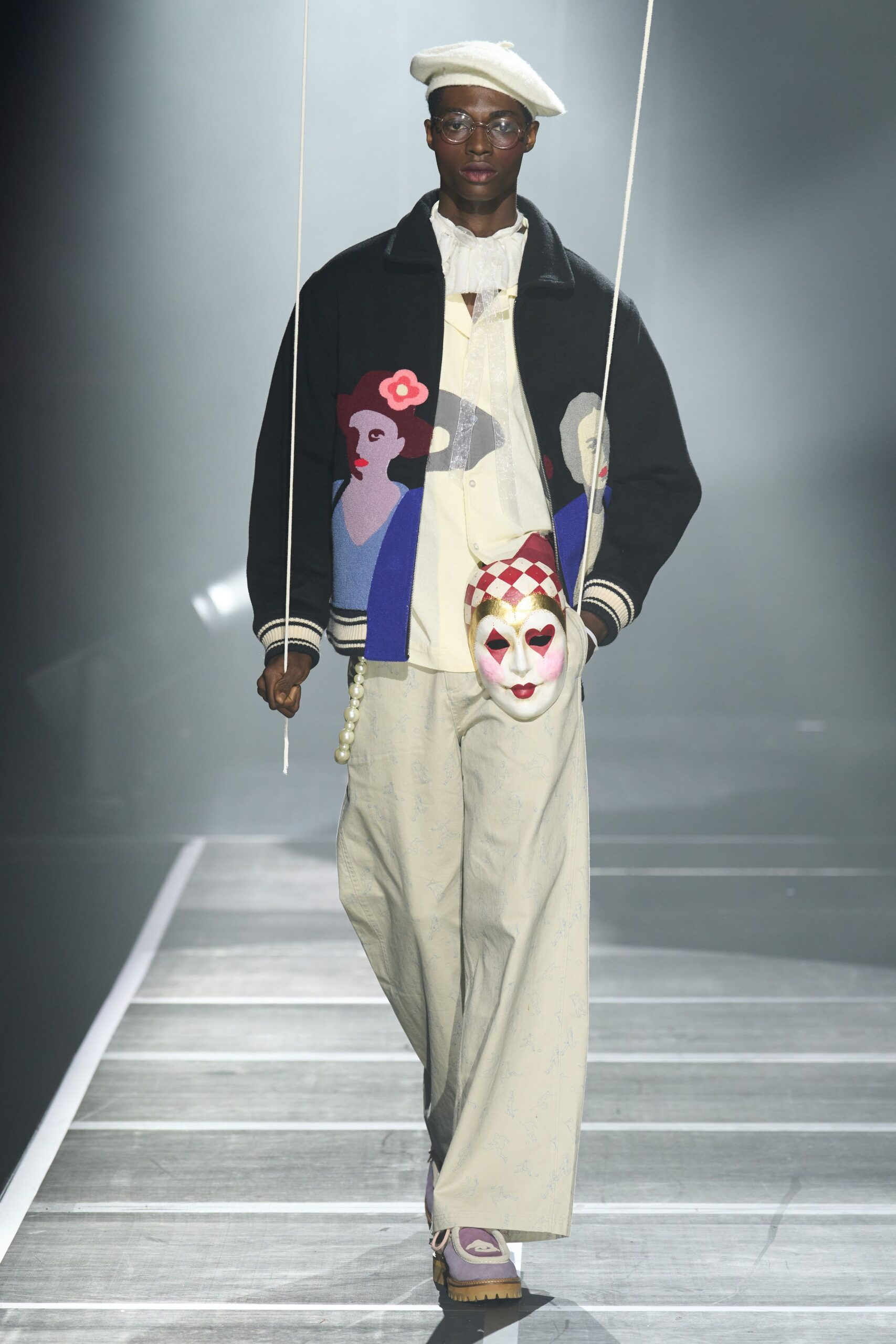 embroidered jacket with beige pants
