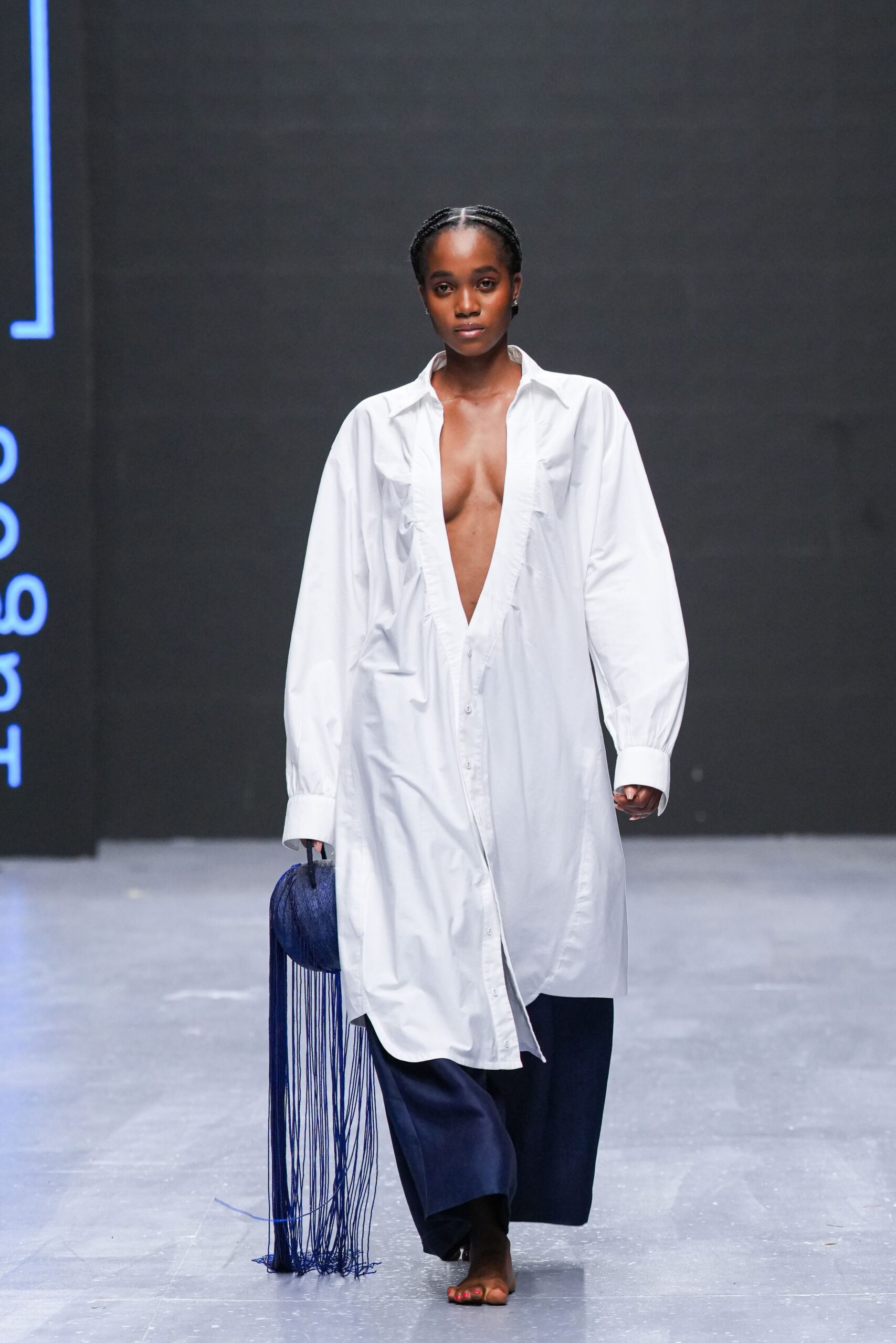 white shirt-dress with blue pants