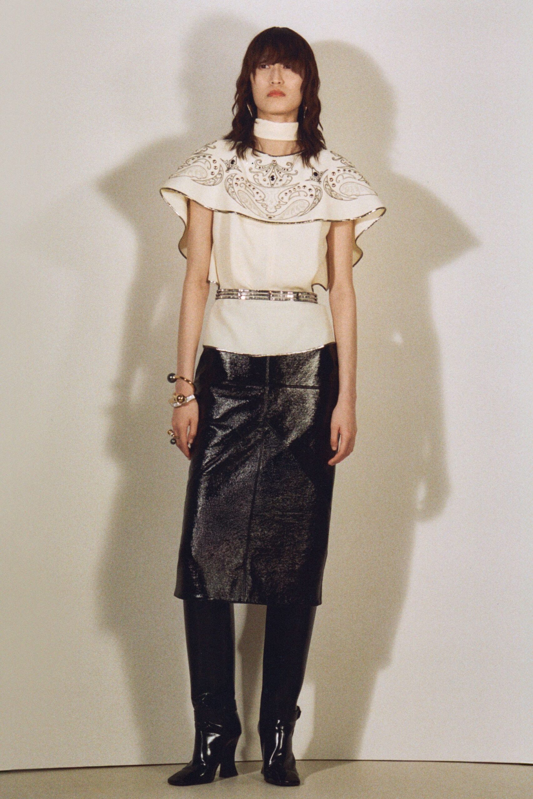 white embroidered top black pencil skirt