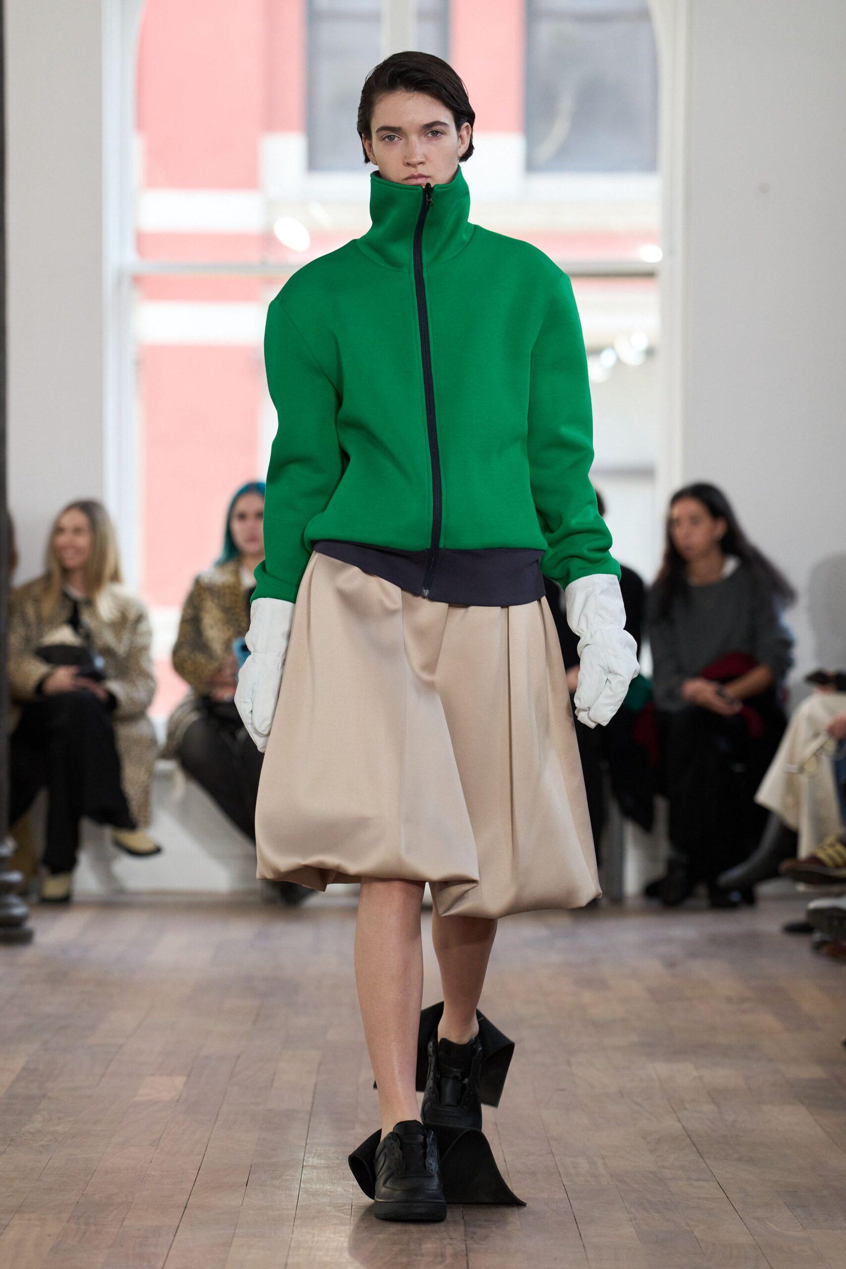 green relaxed jacket beige pleated skirt