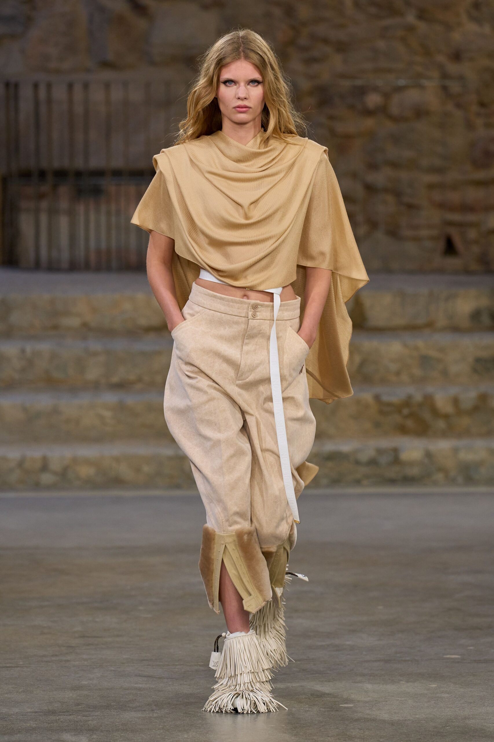 beige draped top with fringed pants