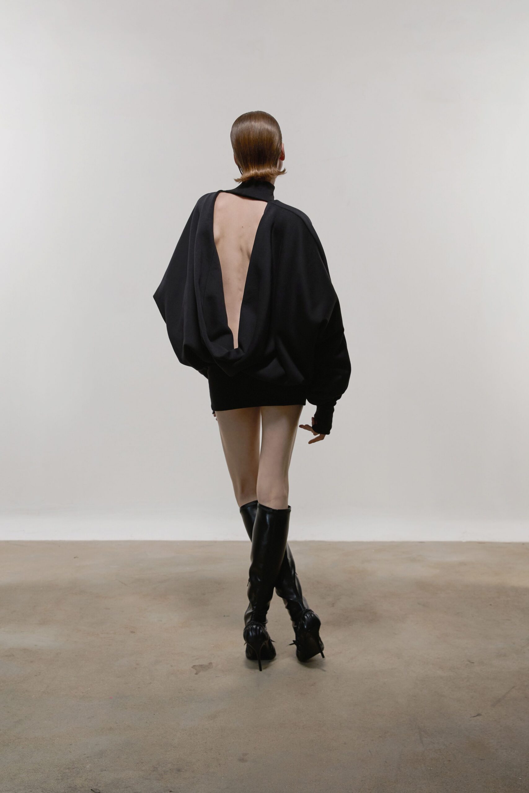 black relaxed mini dress with boots