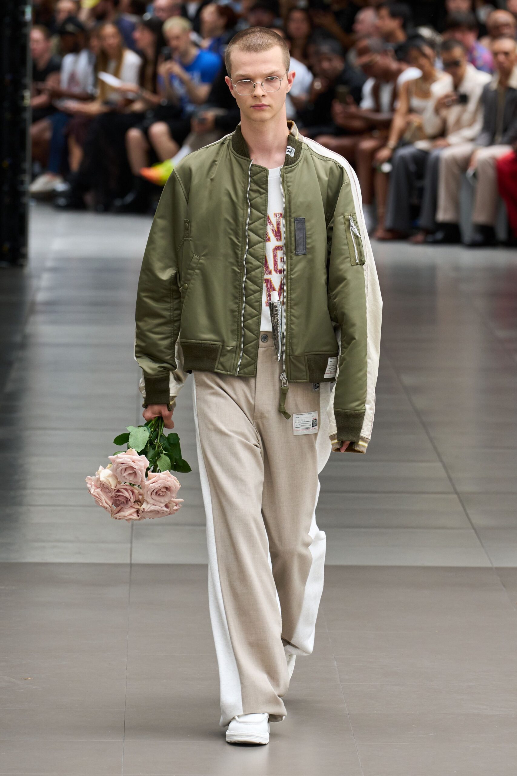 green relaxed jacket with beige pants
