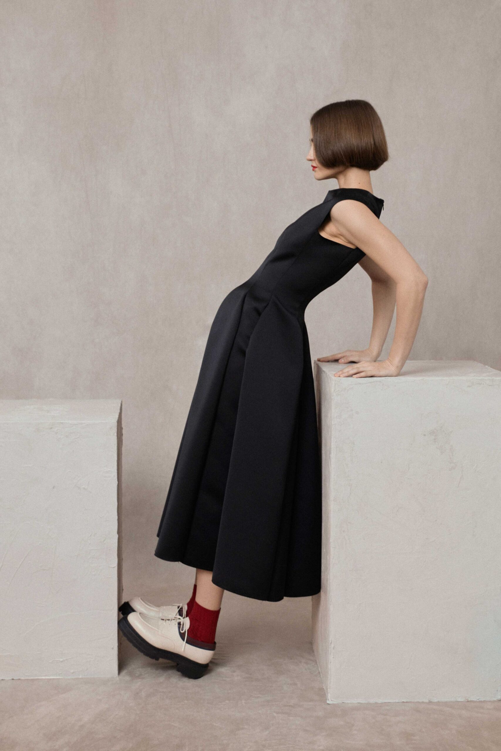 black fitted midi dress with chunky shoes