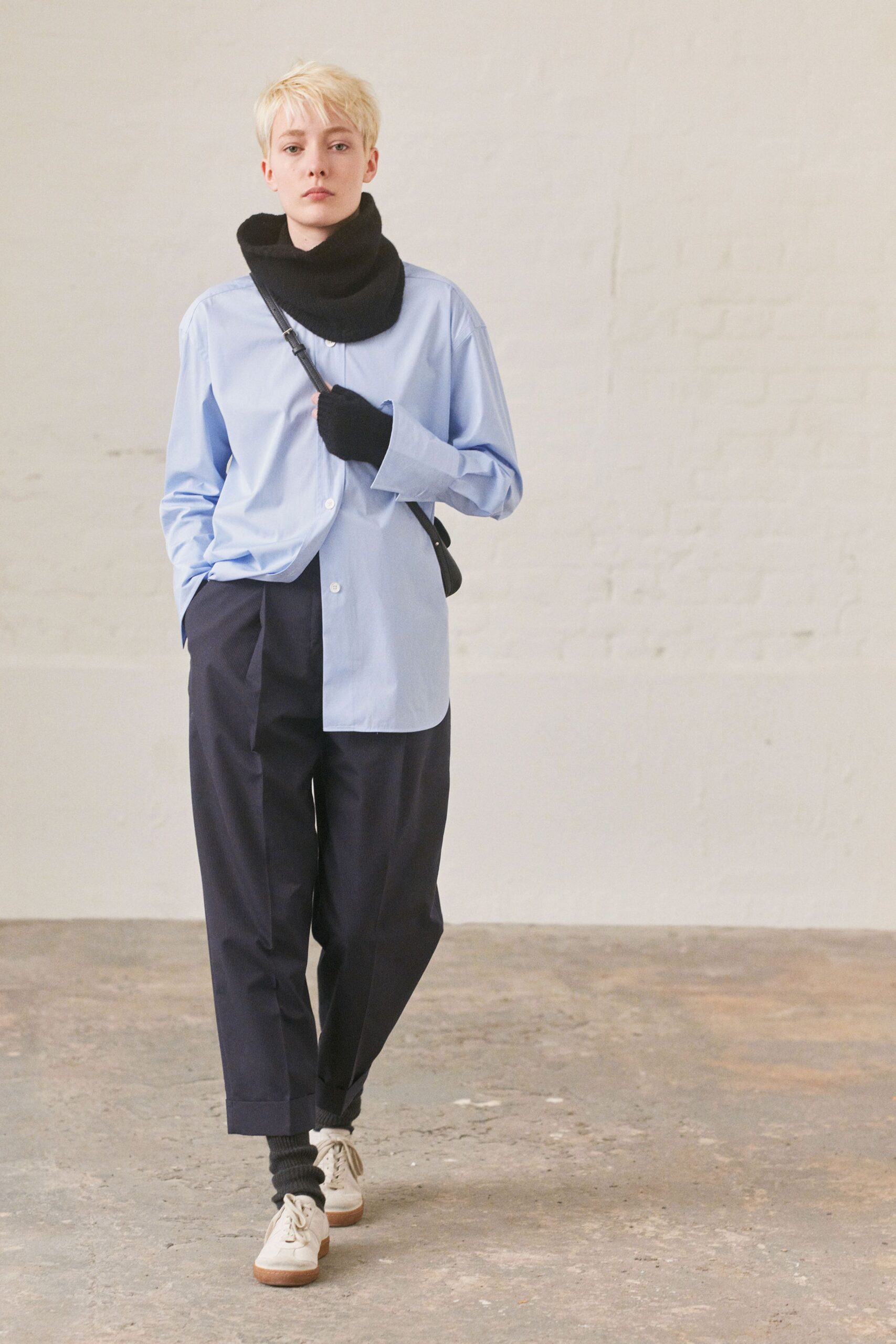 blue cotton shirt and black pants