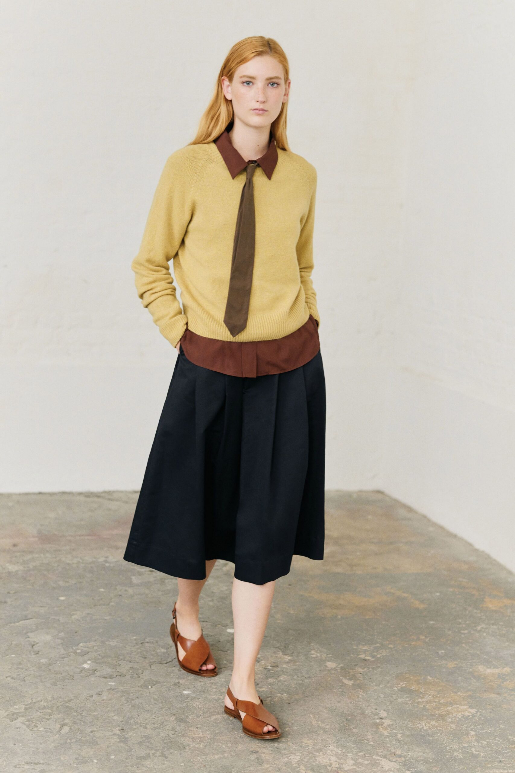 yellow wool sweater with brown shirt