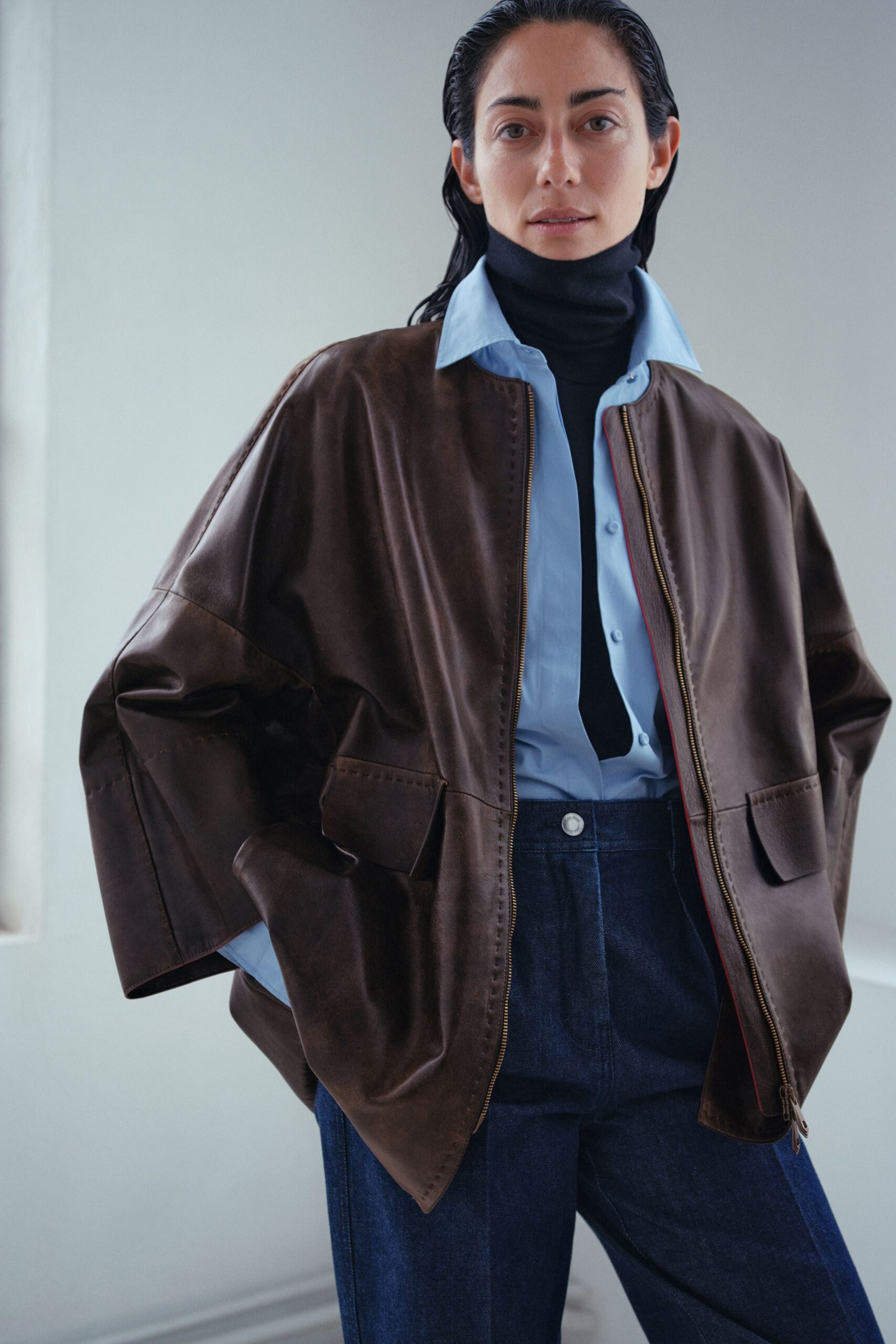 brown leather jacket with blue shirt